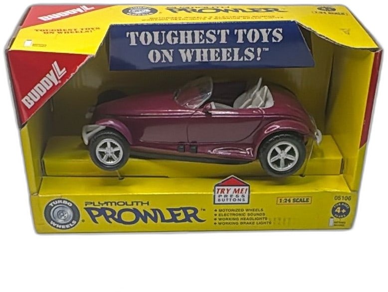 Buddy L Plymouth Prowler 1:24 Scale Turbo Wheels Toy Car 1998 Boxed: Buddy L Plymouth Prowler 1:24 Scale Turbo Wheels toy car in original 1998 box. Features motorized wheels, electronic sounds, working headlights, and brake lights. Metallic purple die-cast body with pl