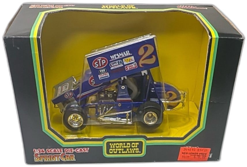 1994 Racing Champions World Of Outlaws 124 Scale Diecast Sprint Car STP Blue: 1994 Racing Champions World Of Outlaws 1:24 Scale Diecast Sprint Car, STP #2 blue edition. Features authentic sponsor logos like STP and Richard Petty Driving Experience. Metal construction, factory s