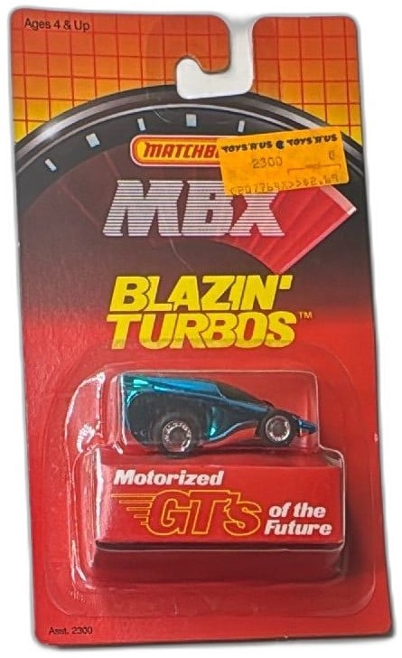 Matchbox MBX Blazin Turbos Motorized GTs Blue Diecast Car 1986 Sealed: Vintage 1986 Matchbox MBX Blazin’ Turbos Motorized GTs of the Future in blue, mint on sealed card. Rare collectible toy car, produced in collaboration with Takara, featuring futuristic design and pu