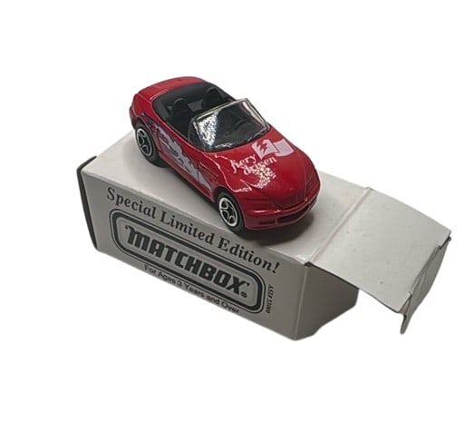 Matchbox 1996 BMW Z3 Special Limited Edition Fiery Driven Red Diecast Car: Matchbox 1996 BMW Z3 diecast car, Special Limited Edition, features "fiery driven" graphics on a bright red convertible body. Diecast metal and plastic in 1:57 scale, with authentic BMW details and bl