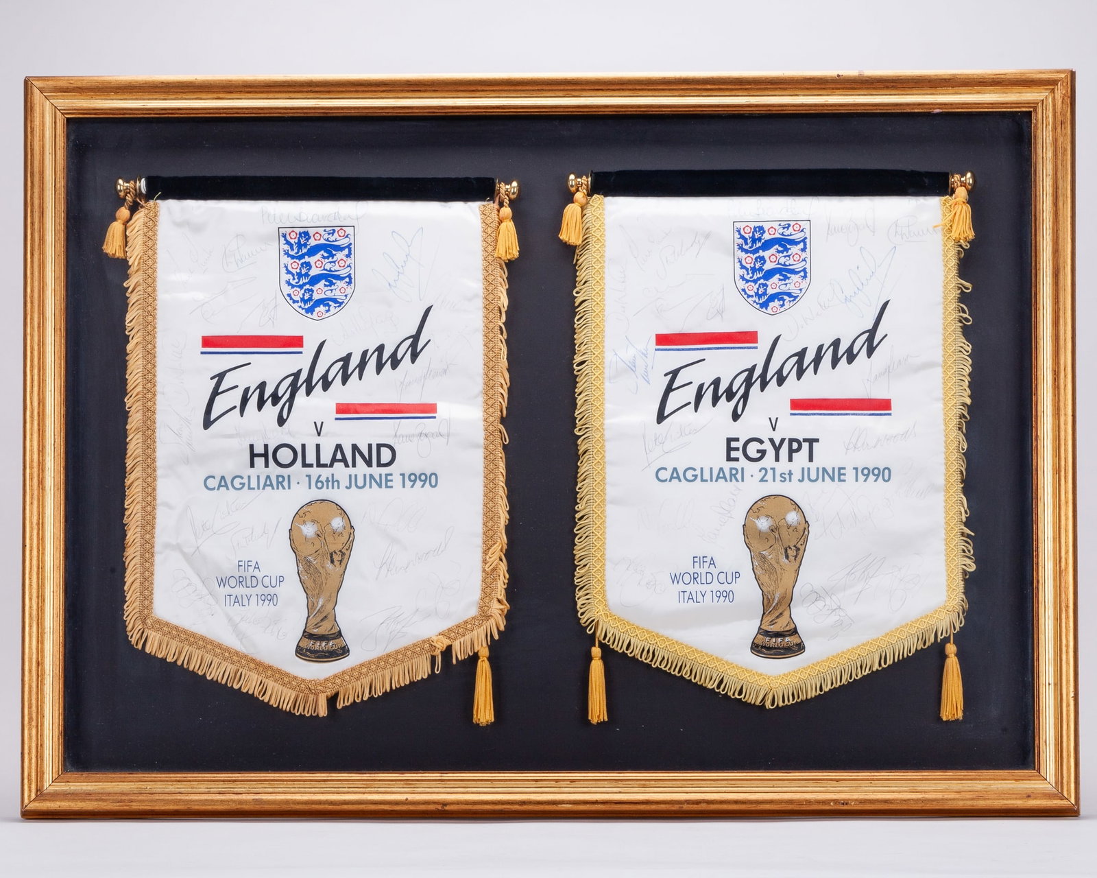 Paul Parker two England Italia 90 autographed pennants?: Paul Parker two England Italia 90 autographed pennants, comprising Holland, 16th June 1990 and Egypt, 21st June 1990, both mounted and framed, 84 x 60cmThe following lots 203 to 207 relate to Queen's 