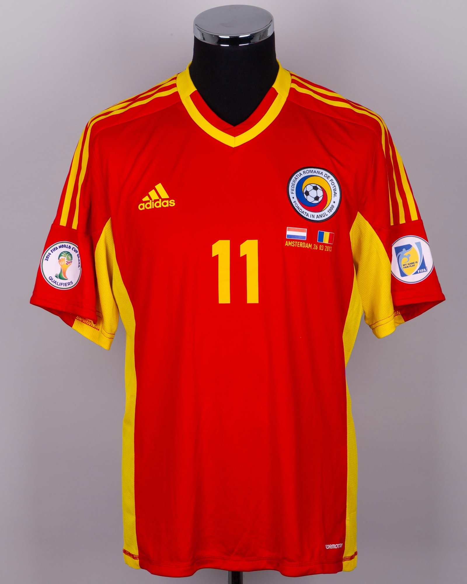 Gabriel Torje red and yellow No.11 Romania v. Holland short-sleeved shirt, 2013: Gabriel Torje red and yellow No.11 Romania v. Holland short-sleeved shirt, 2013, Adidas, L, with v-neck collar and embroidered cloth badge, with flags of nations AMSTERDAM, 26.03 20013 decal, the reve