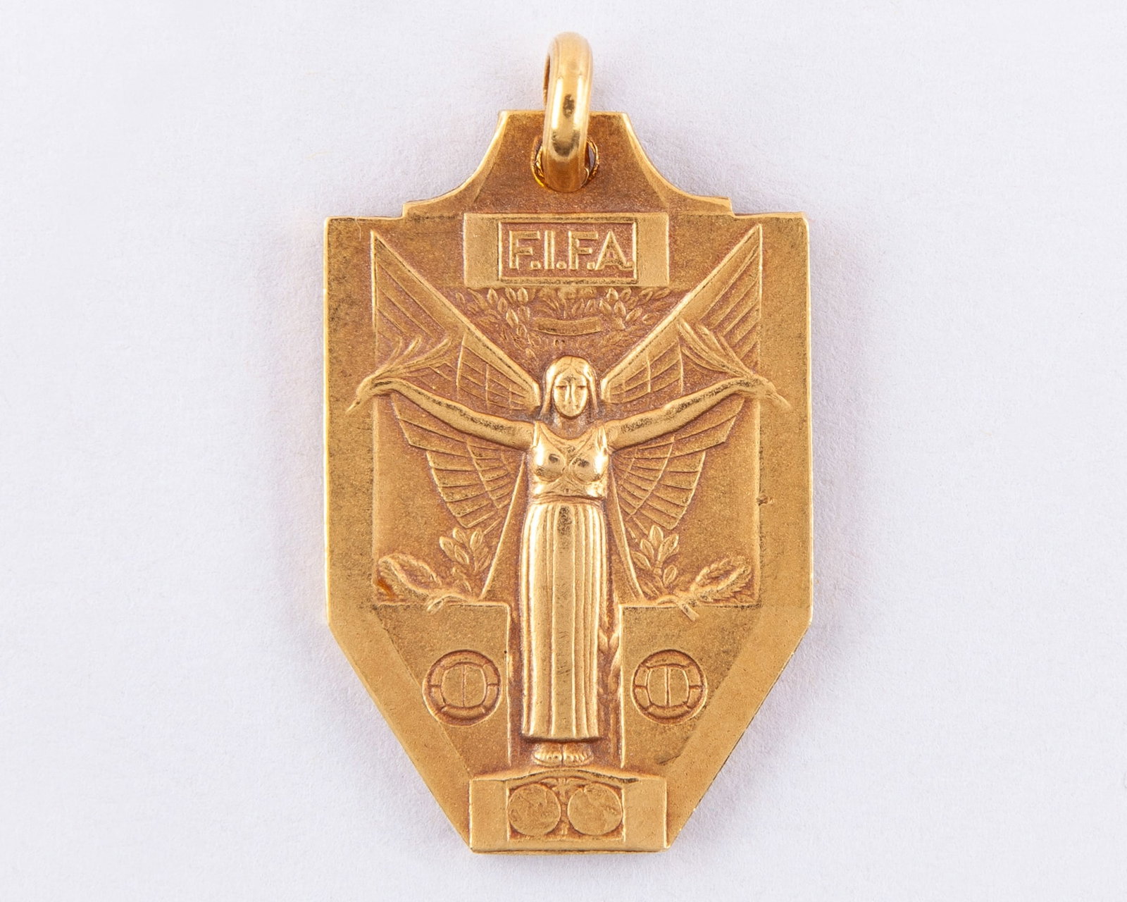 Pele: Continental gold 1958 World Cup Final winners medal: Pele: Continental gold 1958 World Cup Final winners medal, the obverse inscribed FIFA, the reverse inscribed WORLD CHAMPIONSHIP JULES RIMET CUP SWEDEN 1958, with bespoke display stand?Provenance: Juli