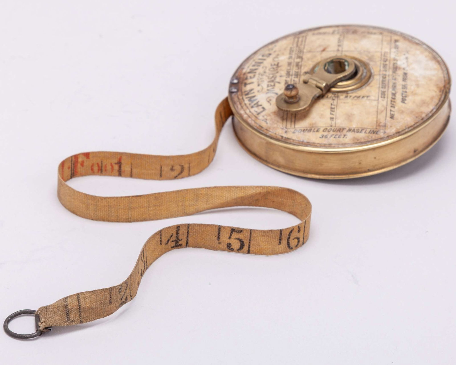 An early brass Lawn Tennis measure, the face with applied label detailing the court shape - 8