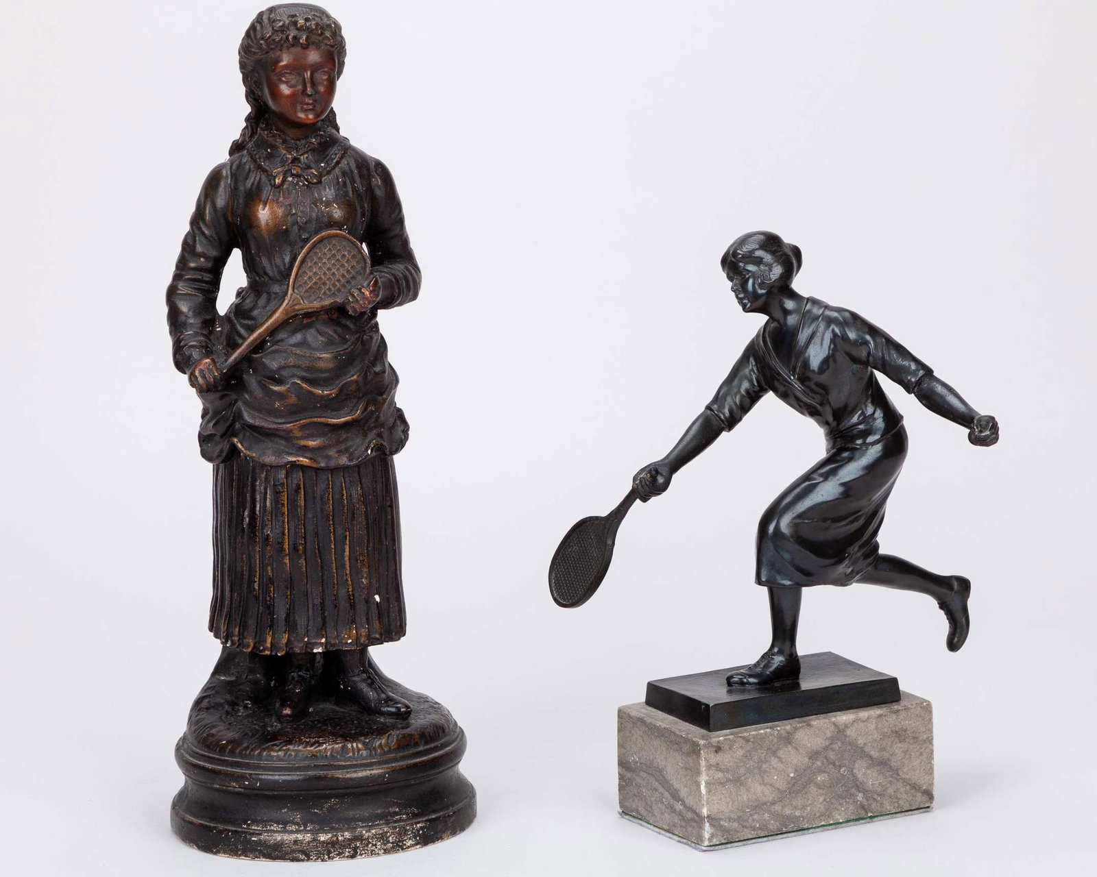 A 20th Century bronze figure of a female tennis player : A 20th Century bronze figure of a female tennis player on marble base, 25cm high and a plaster figure of a female tennis player, 36cm high (2) 