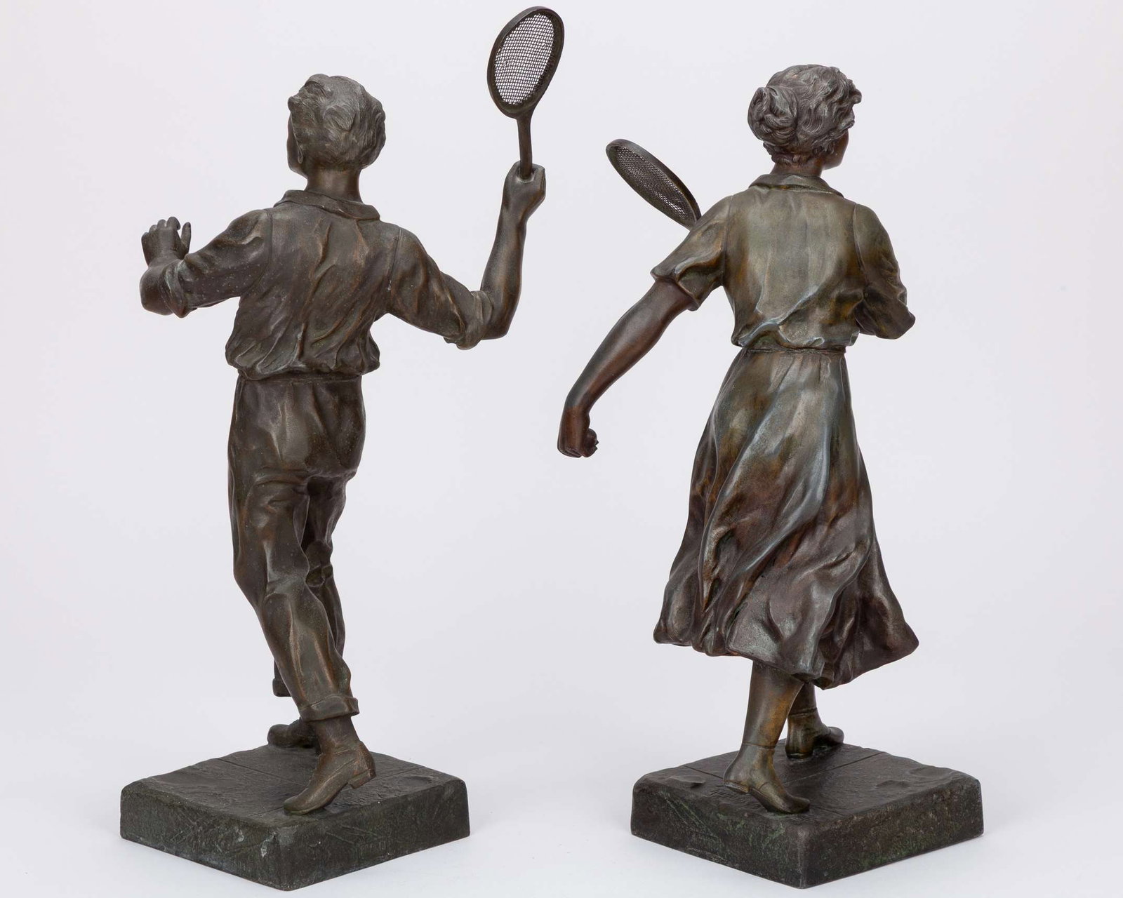 A pair of matched, very detailed possibly from the 1920s showing a male and female player - 2