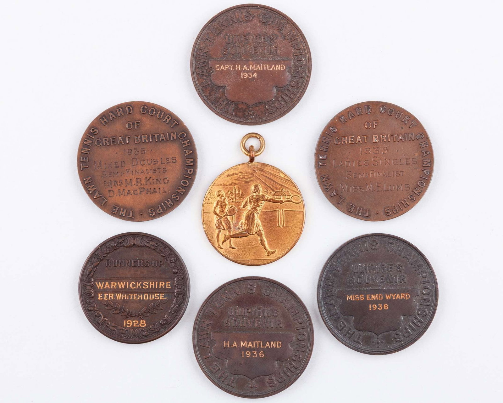 Five bronze tennis Inter-County Cup Warwickshire medals: Five bronze tennis Inter-County Cup Warwickshire medals, E.E.R. Whitehouse, All England L.T.C. Umpires Souvenir - Capt. H.A. Maitland 1934, All England L.T.C. Umpires Souvenir - Miss Enid Wyard