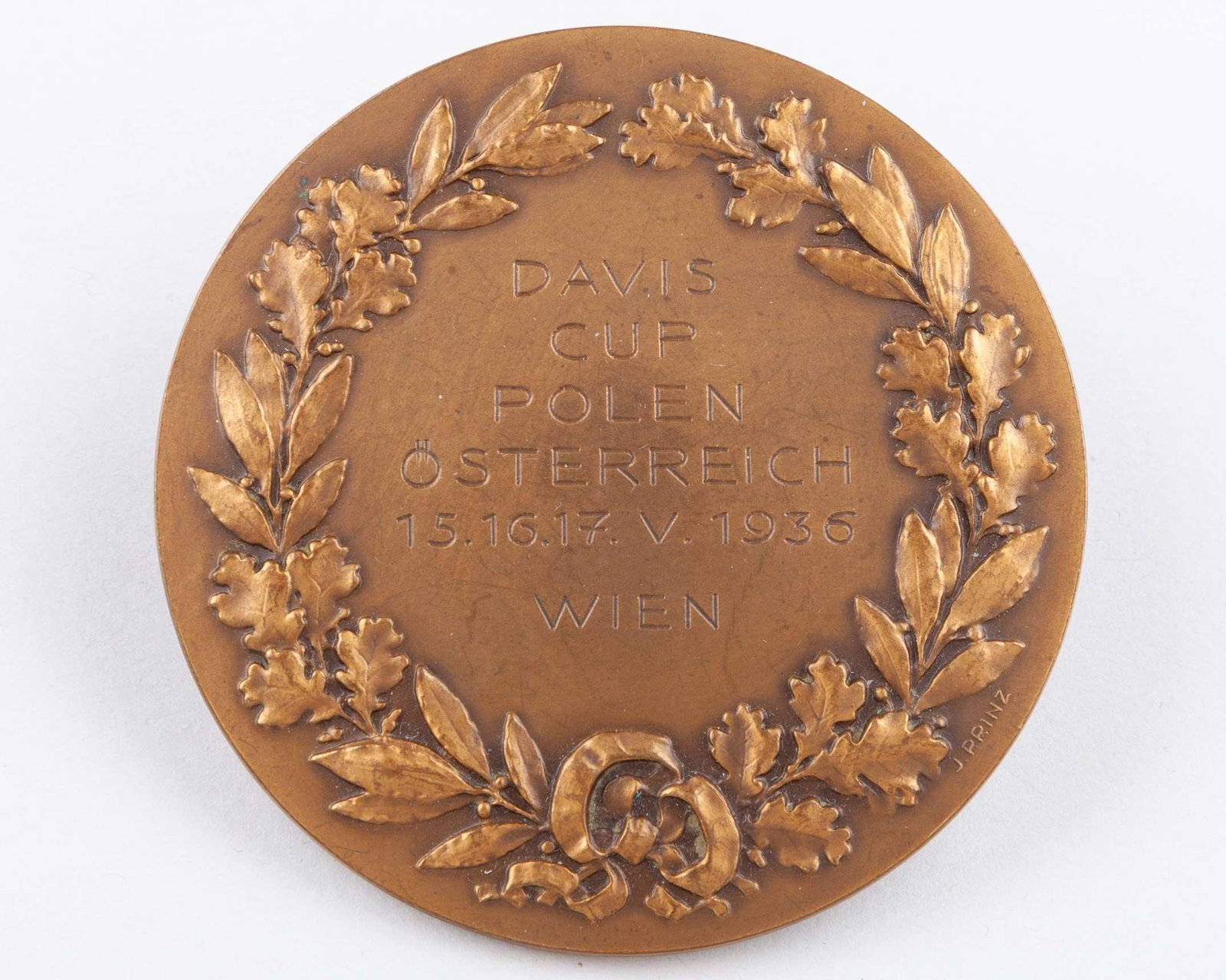 A bronze David Cup medal, 1936: A bronze David Cup medal, 1936, inscribed DAVIS CUP POLEN OSTERREICH 15,16,17 V 1937, WIEN, with three programmes, Great Britain v. USA 28th, 30 and 31st July 1934, Great Britain v. USA, 27th, 29th