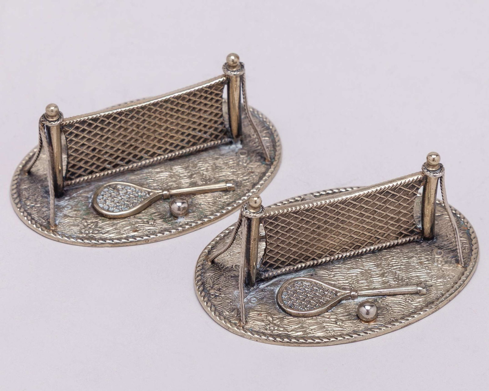 Three white-metal tennis napkin rings, each decorated with two rackets, two balls - 2
