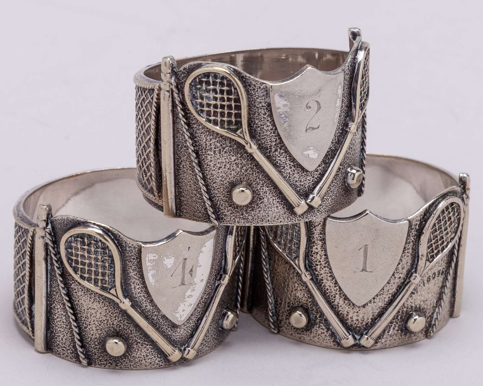 Three white-metal tennis napkin rings, each decorated with two rackets, two balls - 4