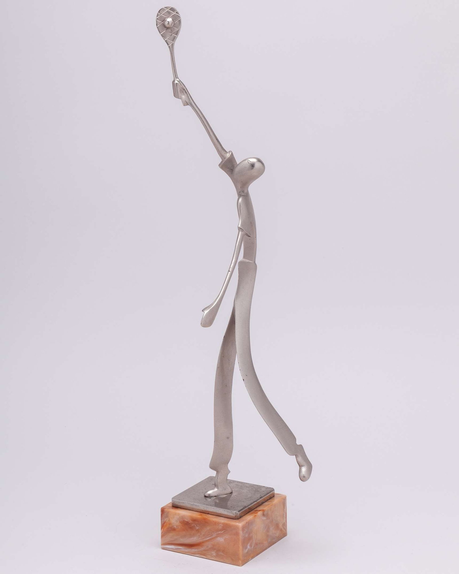 A rare 1930s Hagenauer style figurine mounted onto a square onyx base: A rare 1930s Hagenauer style brush-stell figurine mounted onto a square onyx base, 49cm high 