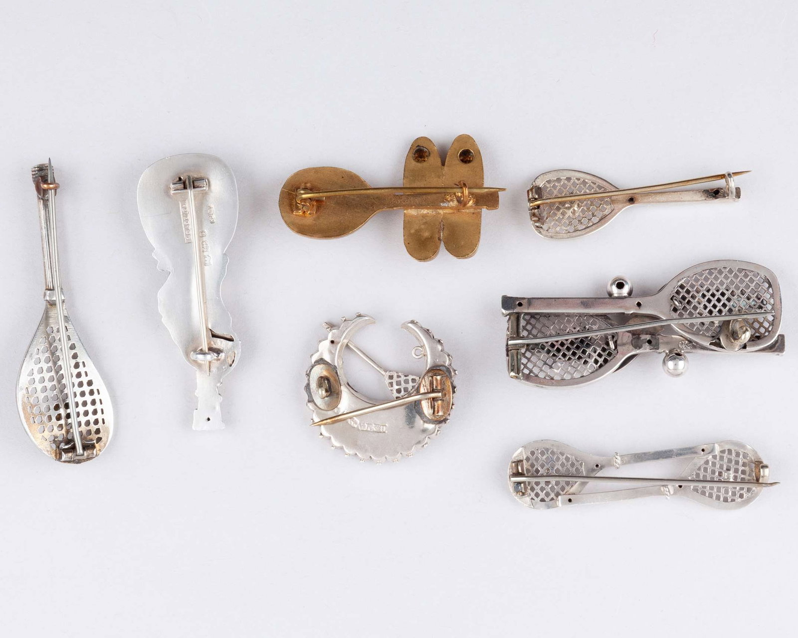 Two silver tennis related brooches, 1885 and 1890 - 2