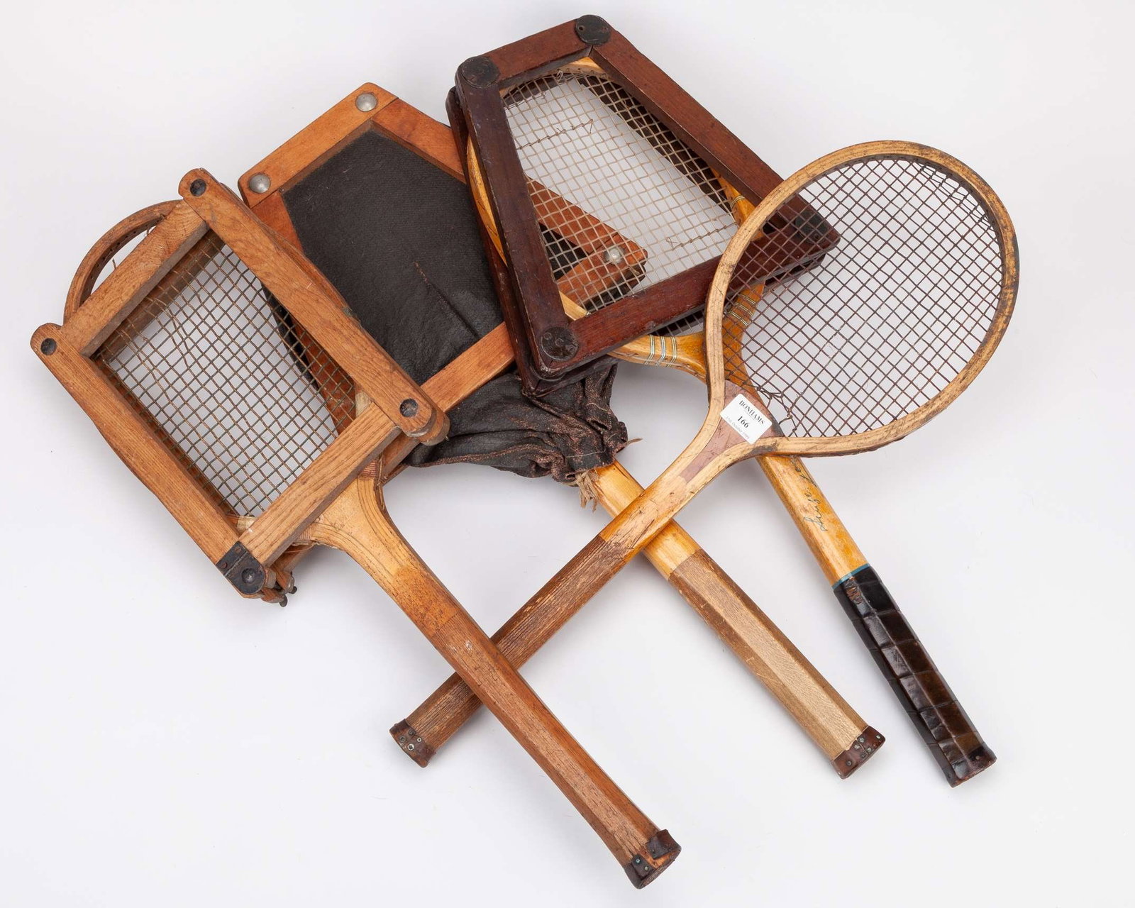 T. H. Prosser & Sons wooden tennis racket and two others: T. H. Prosser & Sons wooden tennis racket, wooden Roehampton Club Wilson tennis racket with press, strings broken, wooden Narragansett 70 Live-Wood tennis racket with press and cover, screw missing