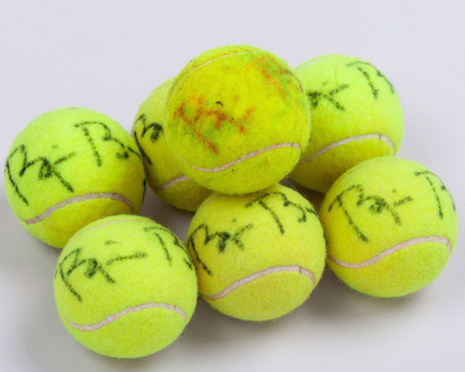 Seven various Bjorn Borg autographed tennis balls: Seven various Bjorn Borg autographed tennis balls, in various condition, some staining and slight fading The signed tennis balls were gifted to the OSPA Cabo Verde Cats and Dogs Rescue Centre by