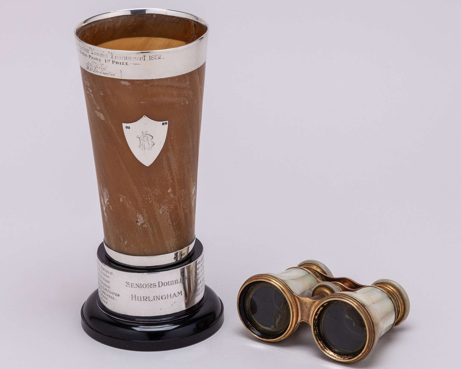 A silver-topped Seaton Lawn Tennis Tournament 1st Prize animal horn trophy: A silver-topped Seaton Lawn Tennis Tournament 1st Prize animal horn trophy, the rim inscribed Seaton Lawn Tennis Tournament 1882, Open Pairs 1st Prize, Won by A. Belfield H.B. Kindersley, with