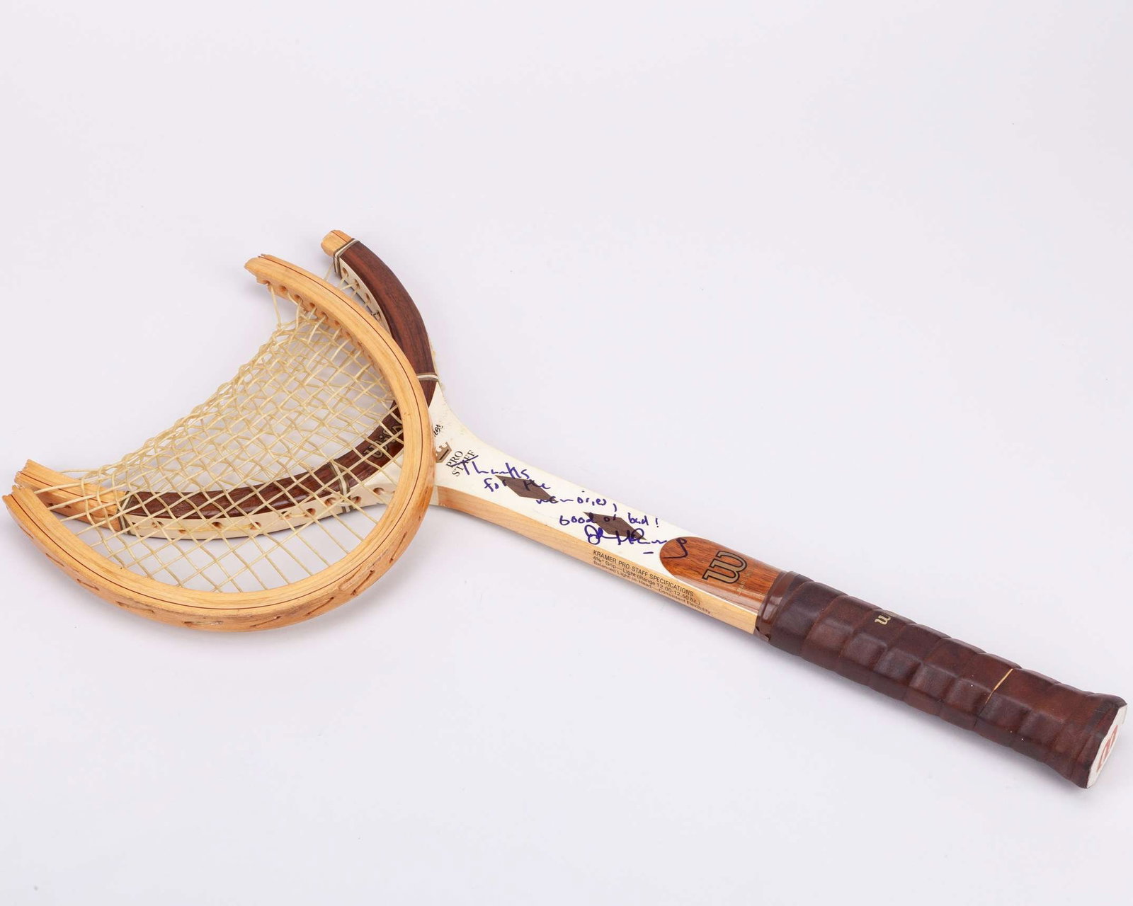 John McEnroe smashed and autographed Wilson Jack Kramer tennis racket, Wimbledon c.1977-80: John McEnroe smashed and autographed Wilson Jack Kramer Pro Staff wooden tennis racket, Wimbledon c.1977-80, made in U.S.A., with 4 5/8" grip, autographed on the shaft in blue ink by McEnroe “Th