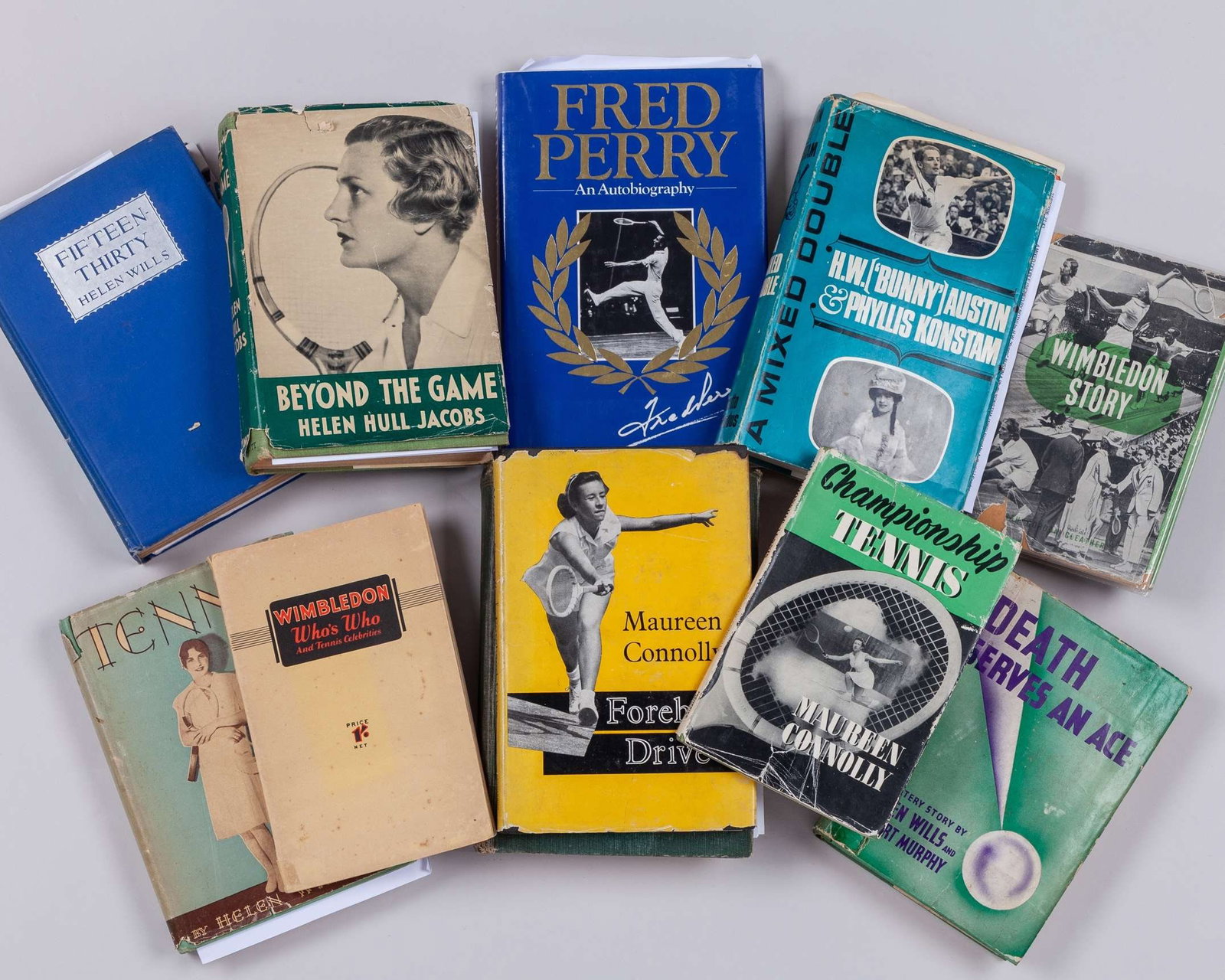 Eleven various tennis related books: Eleven various tennis related books, including Maureen Connolly Forehand Drive, with four tickets, five press box tickets, Helen Wills and Robert Murphy, Death Serves an Ace, 1939, 1st edition, Helen 