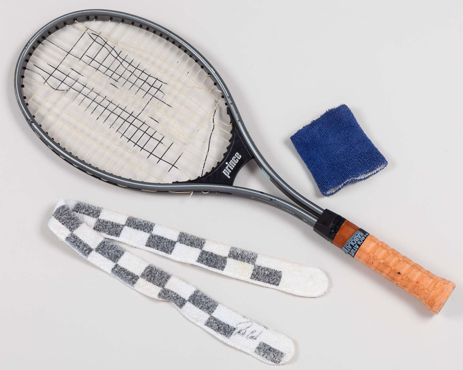 Pat Cash 1987 Wimbledon Champion - a match used Prince Series 90 racket : Pat Cash 1987 Wimbledon Champion - a match used Prince magnesium Pro Series 90 racket, damage to stringing, autographed black and white match used headband and blue match used sweatband (3) 
