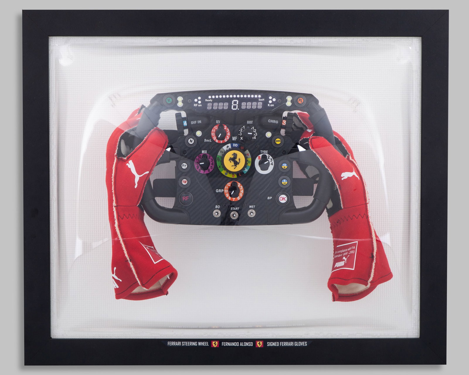 Fernando Alonso 2012 Ferrari Steering Wheel & Gloves Display: Fernando Alonso 2012 Ferrari Steering Wheel & Gloves Display.Fernando Alonso signed official Puma avanti race specification gloves?mounted to a replica steering wheel of his 2012 Ferrari Formula one c
