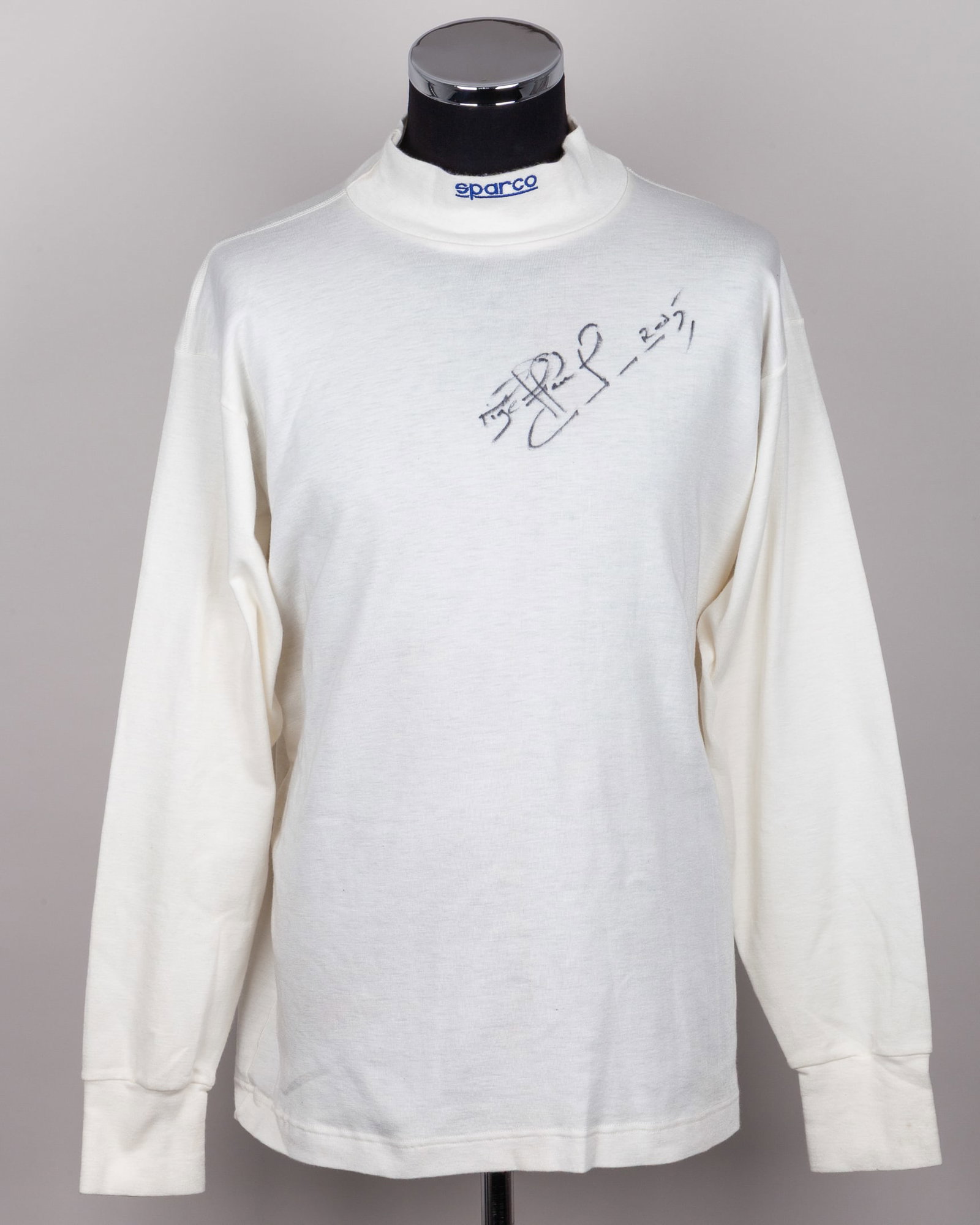 Nigel Mansell Signed Unused Nomex Top: Nigel Mansell Signed Unused Nomex Top.This unused nomex top has been personally signed by the 1992 F1 World Champion.Crafted by Sparco, the label on the nomex top reads: In compliance with FIA Standar