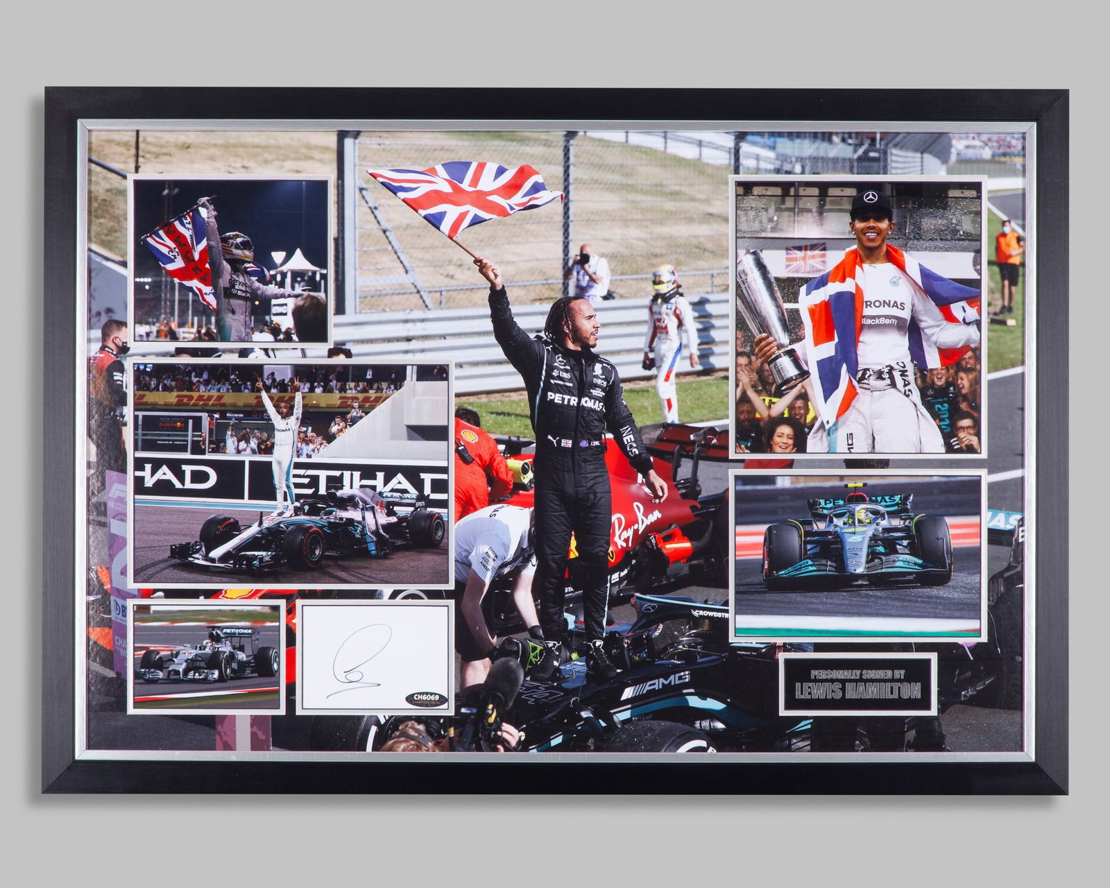 Lewis Hamilton Signed Mercedes Framed Photo Display: Lewis Hamilton Signed Mercedes Framed Photo Display.The white card has been personally signed by the 7-time F1 World Champion. Accompanied with 5 other photo's and plaque description.Complete with a c