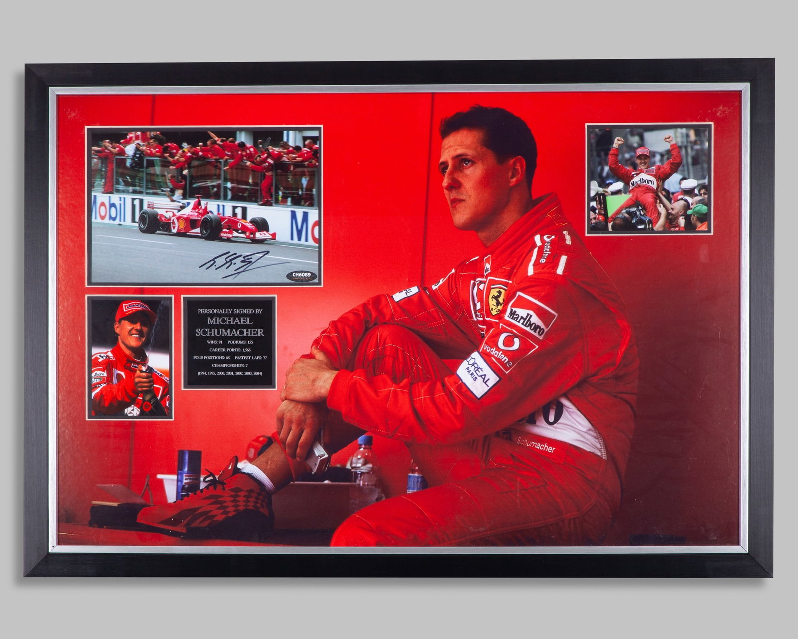 Michael Schumacher Signed Ferrari Framed Photo Display: Michael Schumacher Signed Ferrari Framed Photo Display.1 of the photo's has been personally signed by the 7-time F1 World Champion. Accompanied with 2 other photo's and plaque description.Complete wit