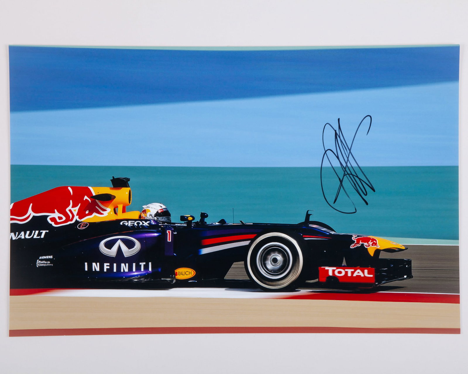 Four Sebastian Vettel Signed Red Bull Racing Large Photos: Four Sebastian Vettel Signed Red Bull Racing Large Photos.Each signed photo measures 46cm length x 30cm width.