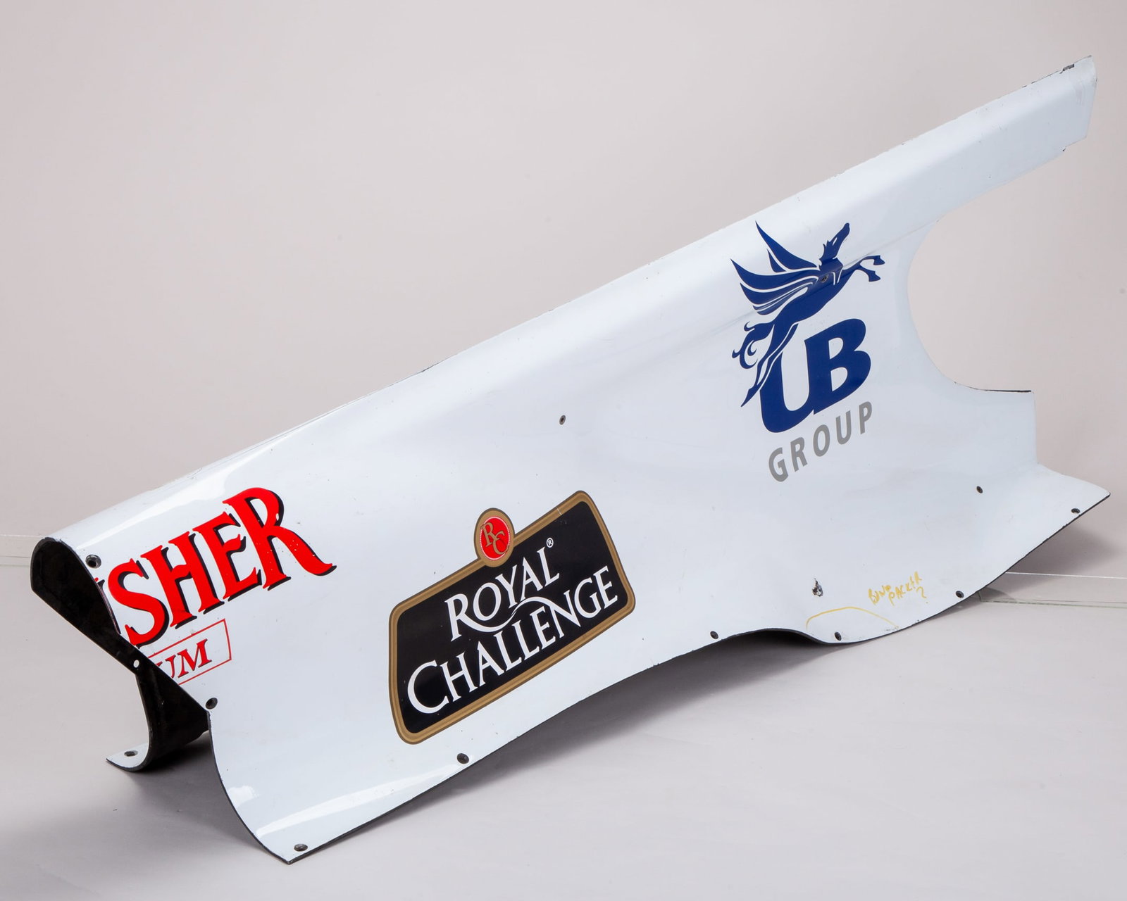 Force India Used Engine Cover: Force India Used Engine Cover.The engine cover is clearly marked with authentic signs of use, showcasing the typical wear and tear that occur during an F1 race weekend.
