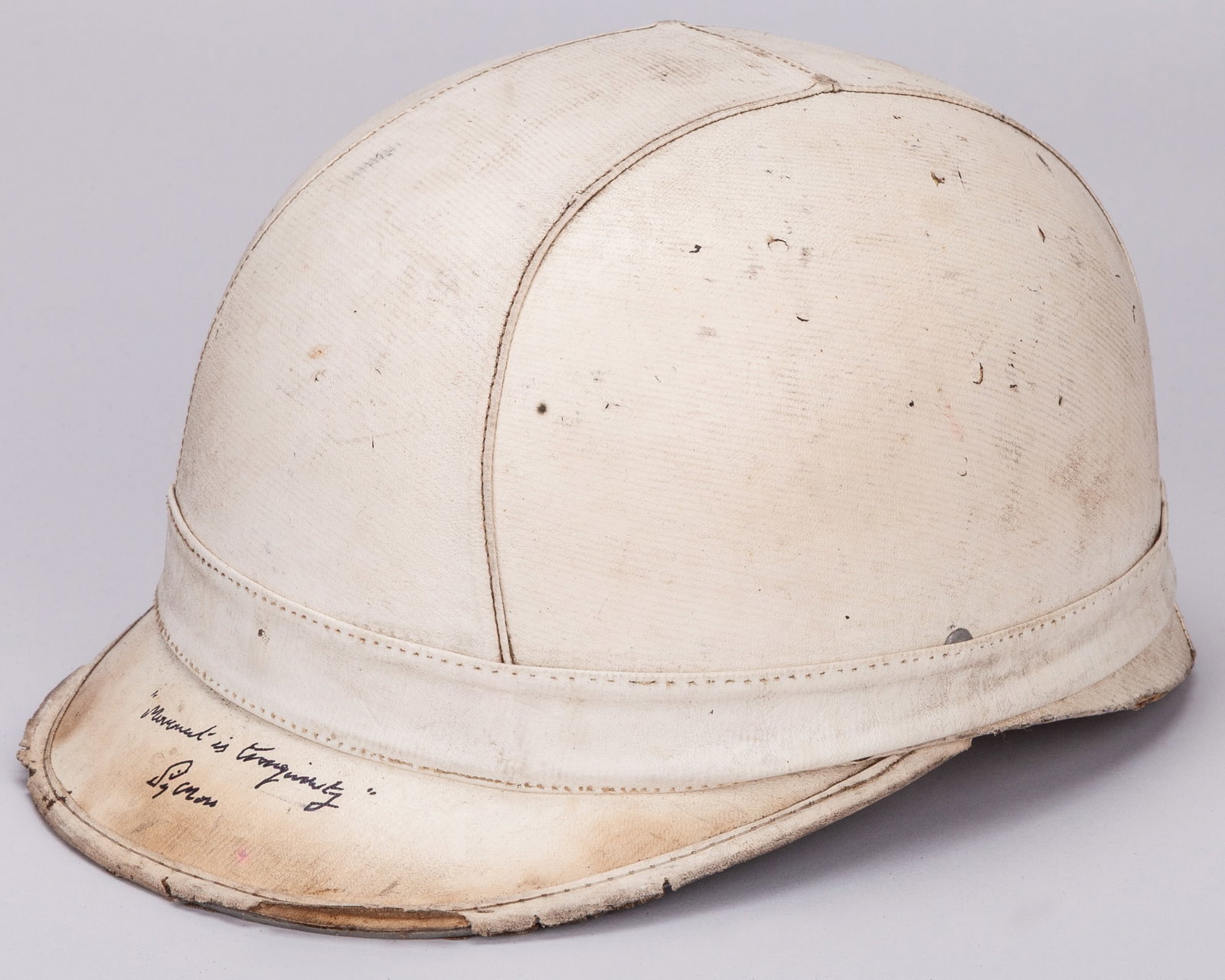 Stirling Moss Signed Corker Style Replica Helmet: Stirling Moss Signed Corker Style Replica Helmet.The helmet is personally signed by legendary British racing driver Sir Stirling Moss, and is inscribed ?Movement is Tranquility? to the front of the he