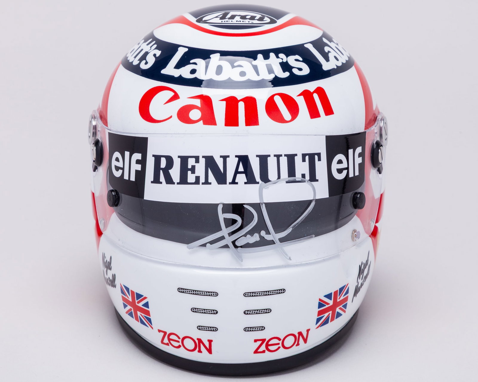 Nigel Mansell 1991 Silverstone Grand Prix Special Edition Signed 1:2 Scale Helmet: Nigel Mansell 1991 Silverstone Grand Prix Special Edition Signed 1:2 Scale Helmet.This 1:2 scale helmet has been personally signed by the 1992 F1 World Champion.Complete in the original helmet box and