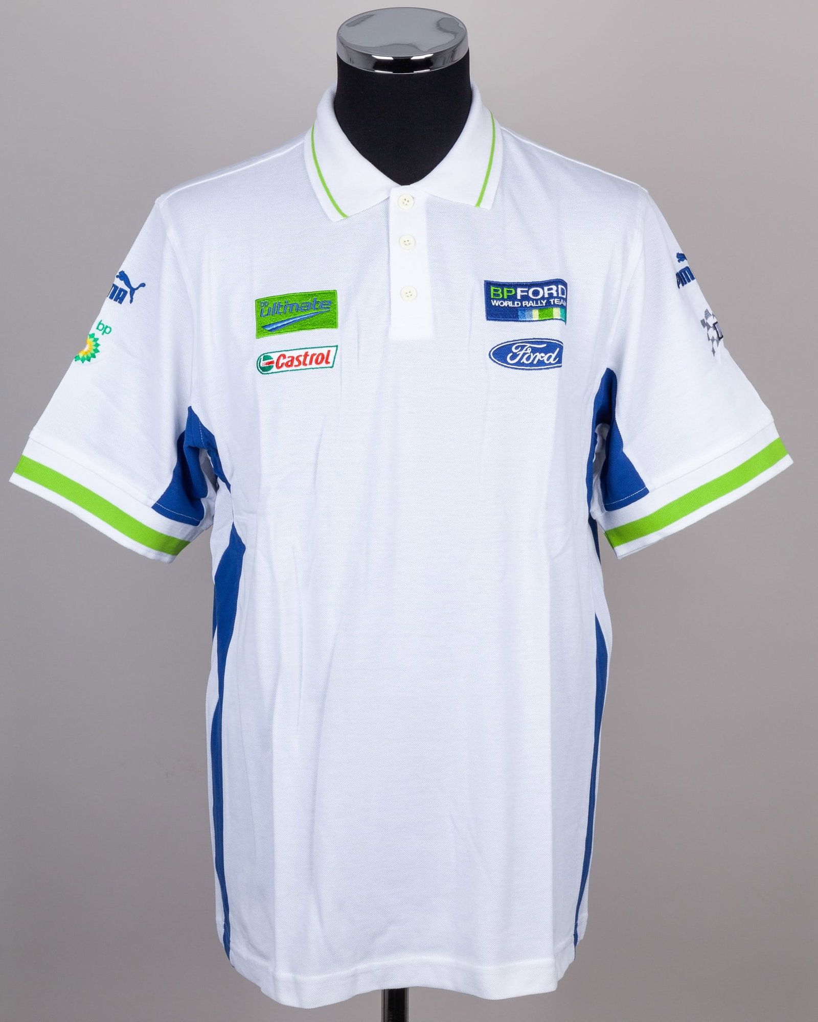 Ford World Rally Polo Shirt (New): Ford World Rally Team Polo Shirt (New).The polo shirt features authentic team branding, in a new, unworn condition. The polo shirt is size large.