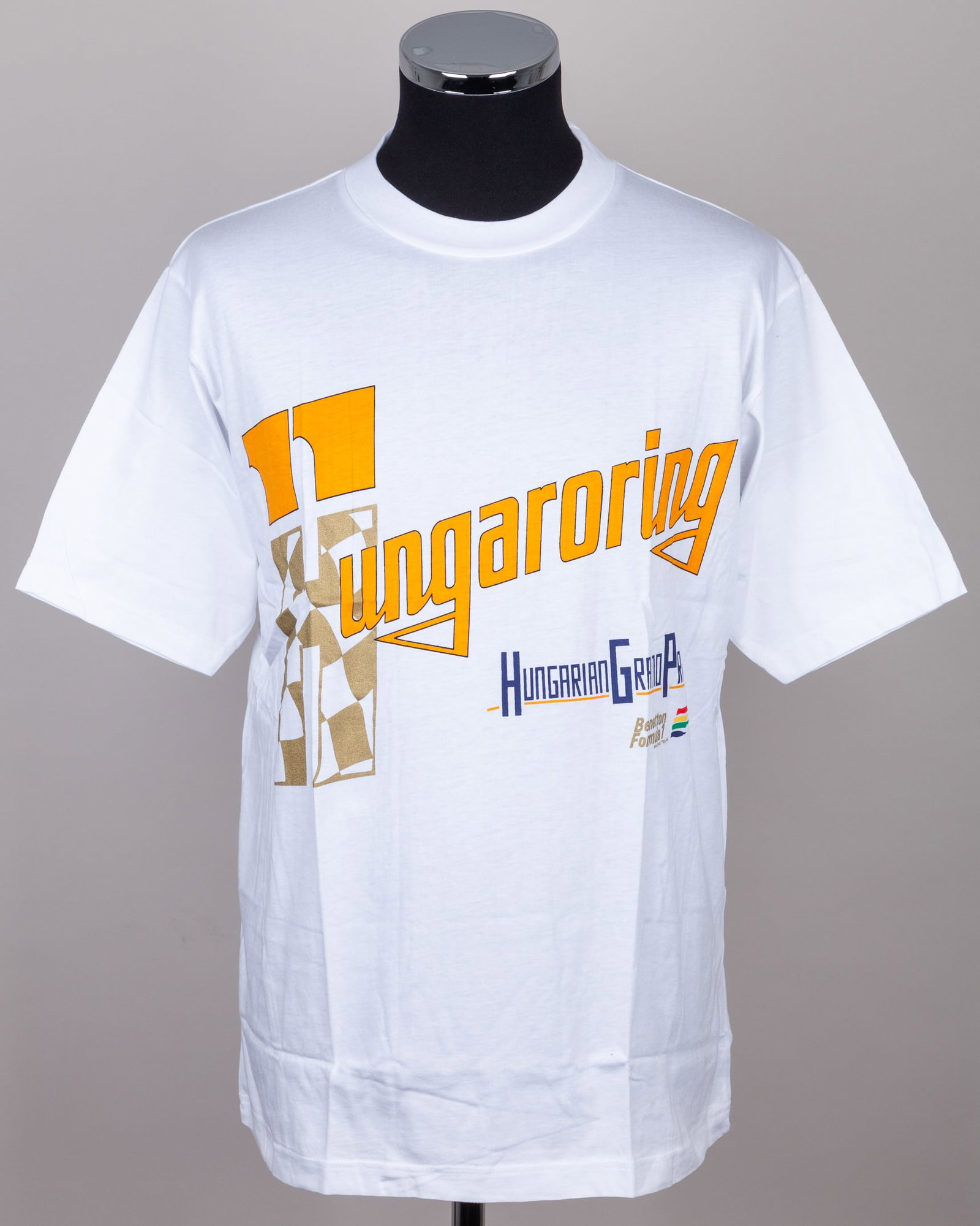 Benetton F1 Racing Team T-Shirt - Hungarian Grand Prix (New): Benetton F1 Racing Team T-Shirt - Hungarian Grand Prix (New).This Benetton F1 Racing Team T-shirt commemorates the Hungarian Grand Prix. Presented in new, unworn condition, with tag.