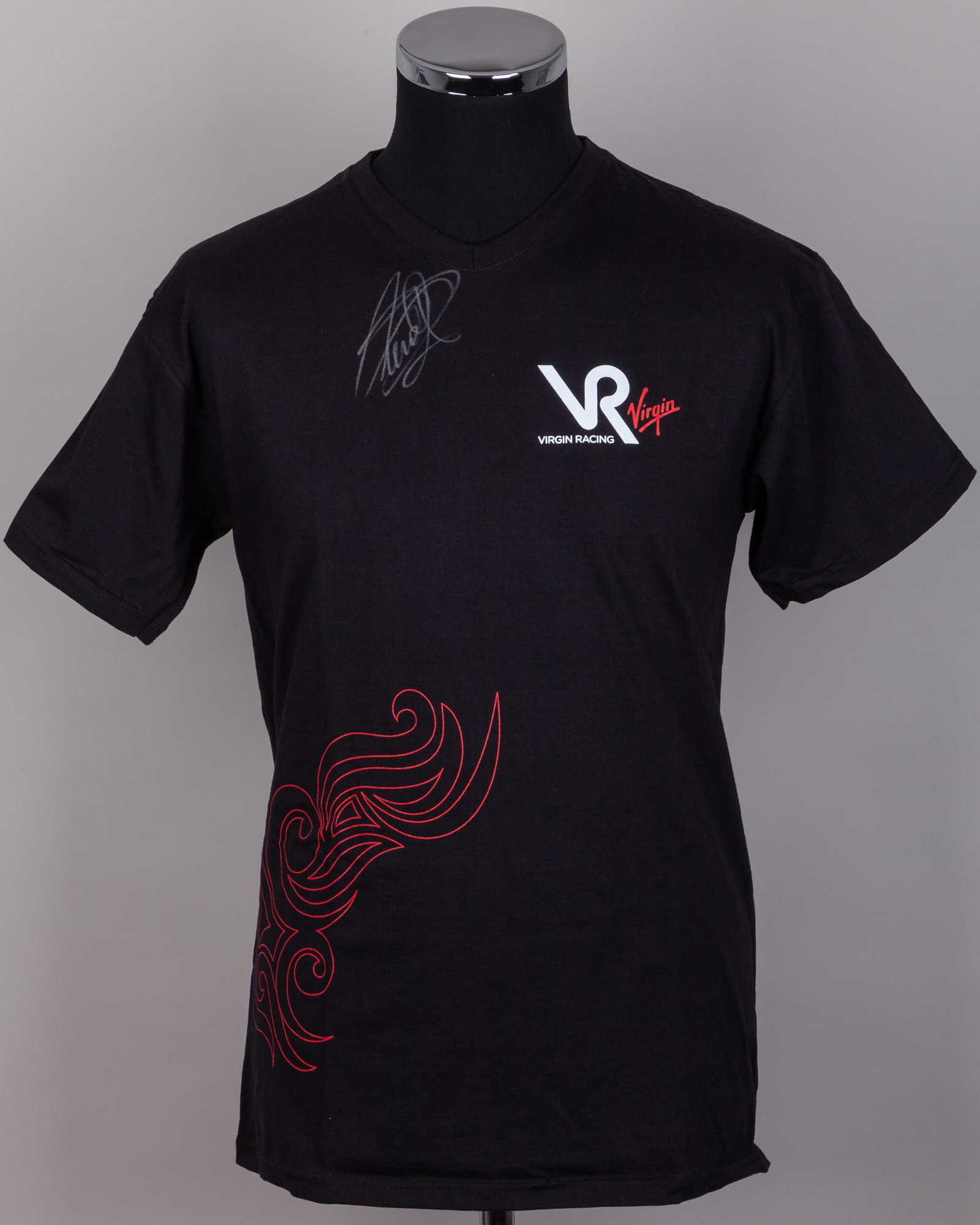 Timo Glock Signed Virgin Racing T-Shirt: Timo Glock Signed Virgin Racing T-Shirt.This stylish team shirt features the distinctive Virgin Racing branding and has been personally autographed by Timo Glock.The t-shirt size is L.