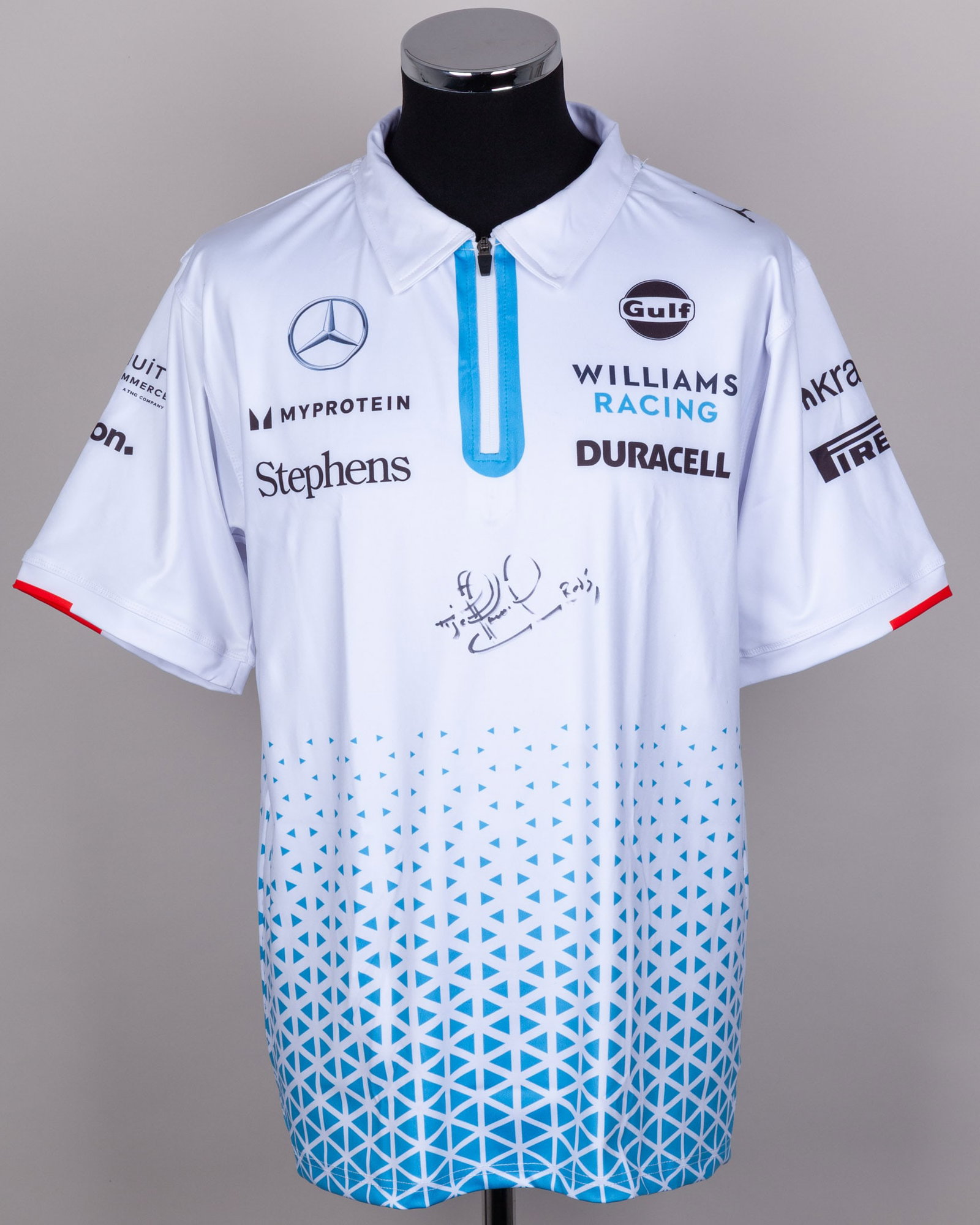 Nigel Mansell Signed Williams Racing Polo Shirt: Nigel Mansell Signed Williams Racing Polo Shirt.This Williams Racing polo shirt is personally signed by the 1992 Formula 1 World Champion. Crafted in the classic team styling and branding.The size is 