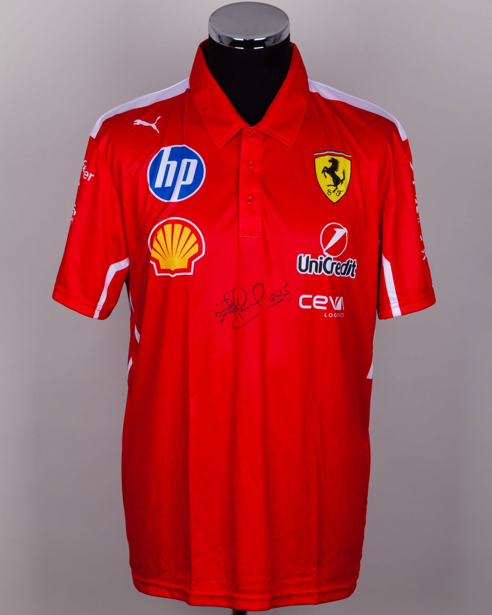 Nigel Mansell Signed Ferrari Polo Shirt (New): Nigel Mansell Signed Ferrari Polo Shirt (New).This is a size Large Ferrari polo shirt with new tag. Personally signed by the 1992 F1 World Champion.?