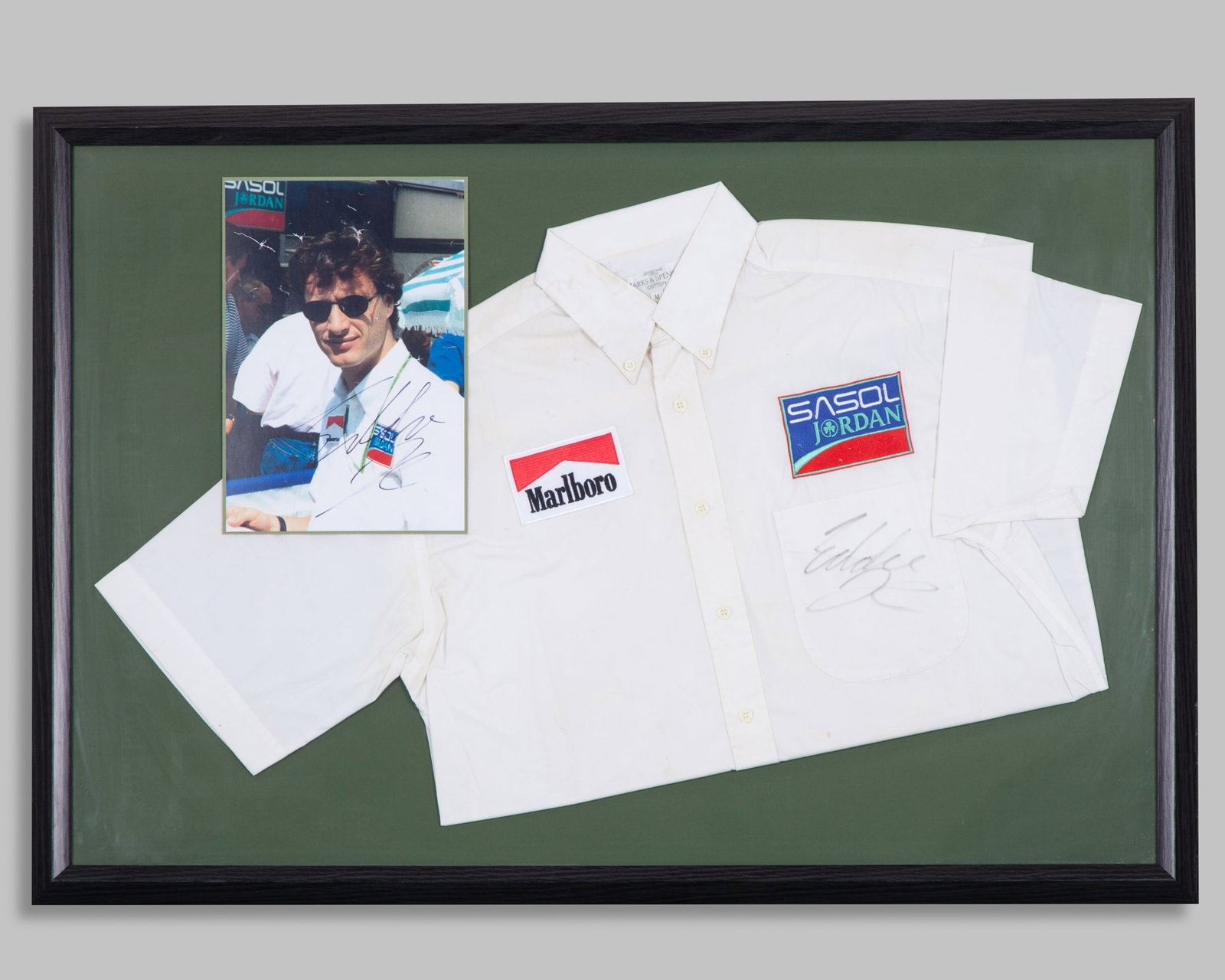 Eddie Irvine Signed Jordan Framed Shirt with Photo: Eddie Irvine Signed Jordan Framed Shirt with Photo.The shirt and photo have been personally signed by F1 fan favourite Eddie Irvine.Complete with a letter of authenticity.The frame measures 97cm lengt