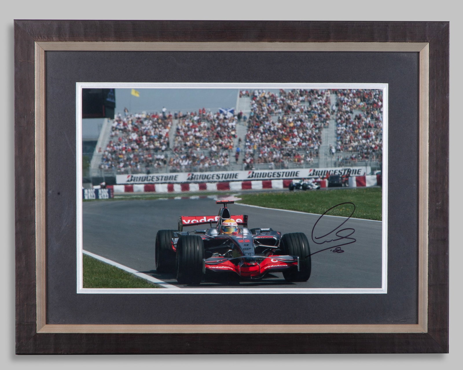 Lewis Hamilton Signed McLaren Framed Photo: Lewis Hamilton Signed McLaren Framed Photo.This photo has been personally signed by 7-time F1 World Champion Lewis Hamilton.The frame measures 52cm length x 40cm width. Framed and glazed.Depending on 