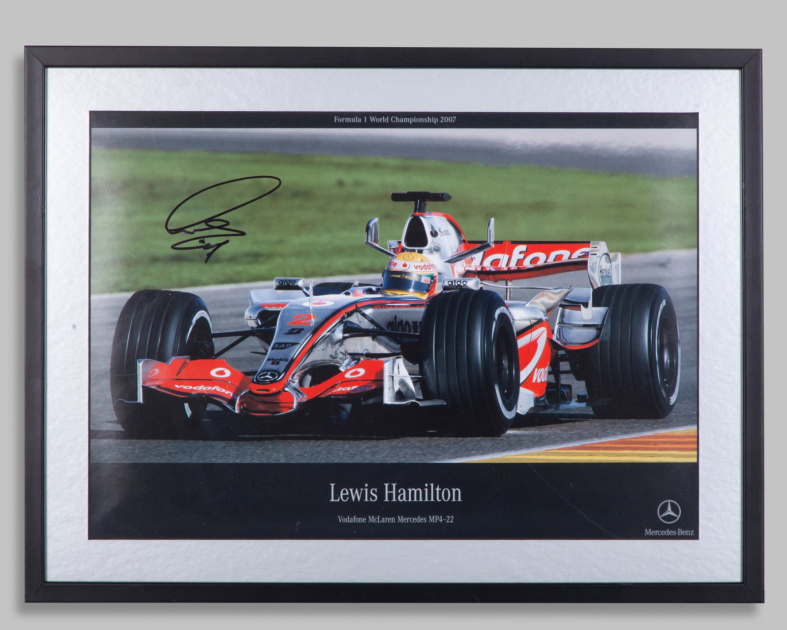 Lewis Hamilton 2007 Signed Vodafone McLaren Mercedes Framed Photo: Lewis Hamilton 2007 Signed Vodafone McLaren Mercedes Framed Photo.This photo has been personally signed by 7-time F1 World Champion Lewis Hamilton. Capturing his debut season in Formula One driving th
