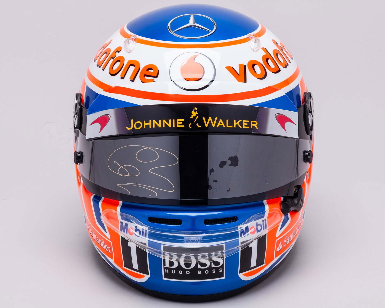 Jenson Button 2011 Vodafone McLaren Mercedes Limited Edition Official Signed Replica Helmet: Jenson Button 2011 Vodafone McLaren Mercedes Full Size Limited Edition Official Signed Replica Helmet.Personally signed by the 2009 F1 World Champion. The helmet showcases the Vodafone McLaren Mercede