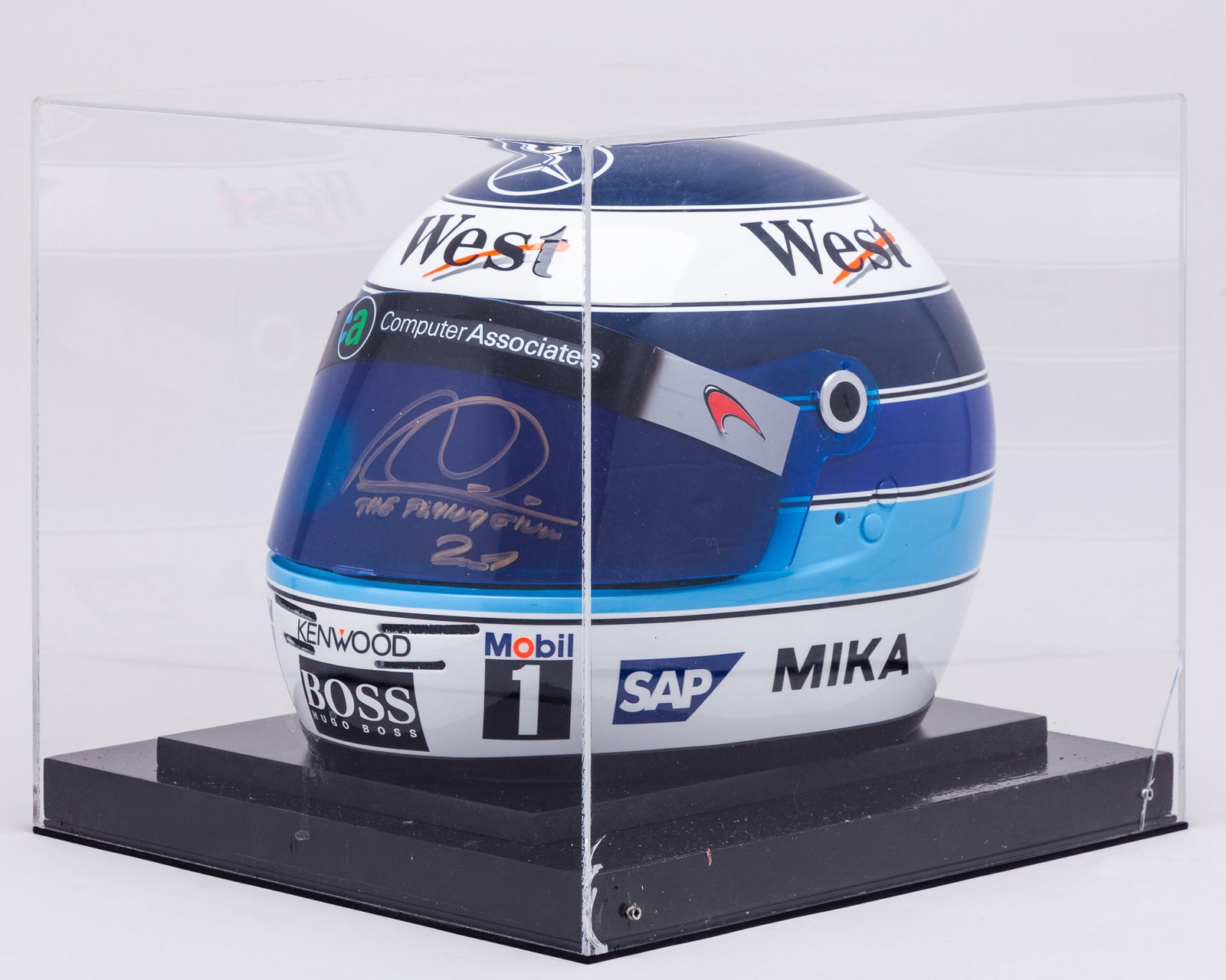 Mika Hakkinen 2001 McLaren Signed Replica Helmet: Mika Hakkinen 2001 McLaren Signed Replica Helmet.?This 2001 McLaren replica helmet has been personally signed by two-time F1 World Champion Mika Hakkinen.Complete in a display case and base.