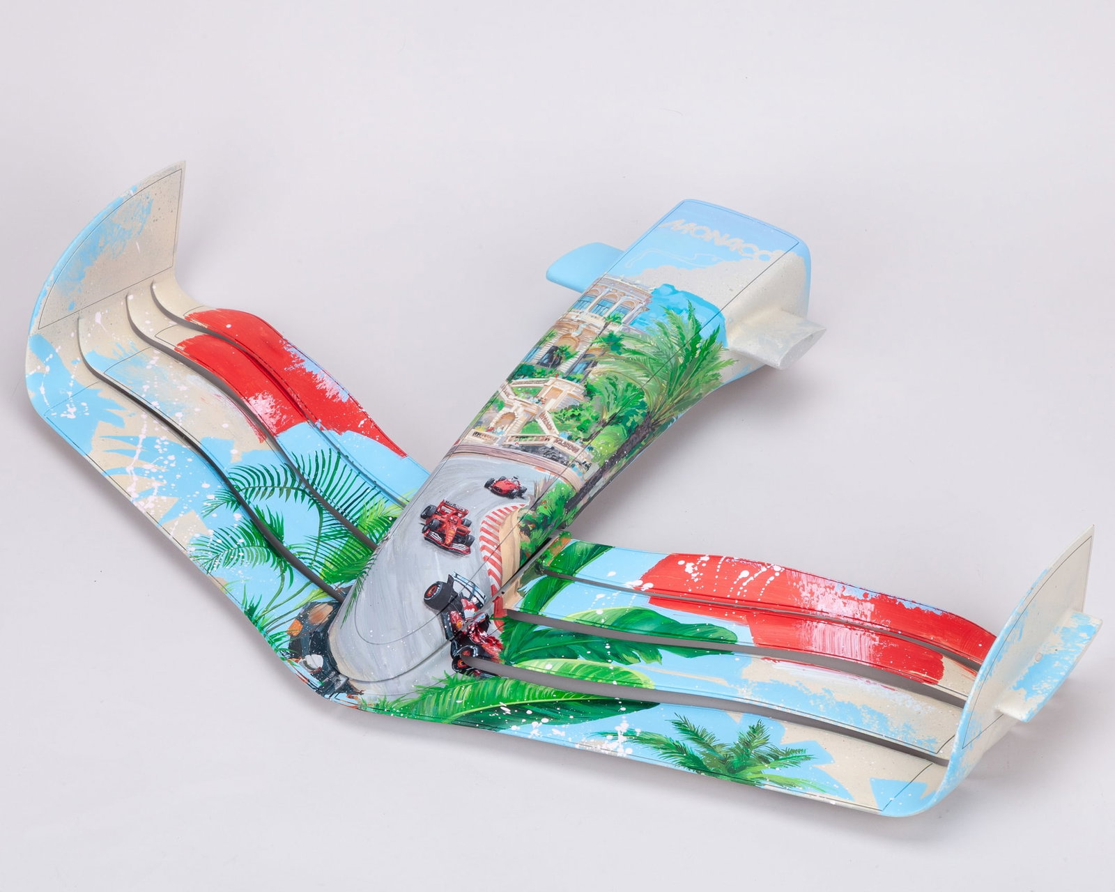 F1 Front Wing Display Artwork - by Cam Createz: F1 Front Wing Display Artwork - by Cam Createz (b. 2005).This is a custom painted F1 front wing replica display, inspired by the legendary Monaco Grand Prix. It features Ferrari racing into the iconic