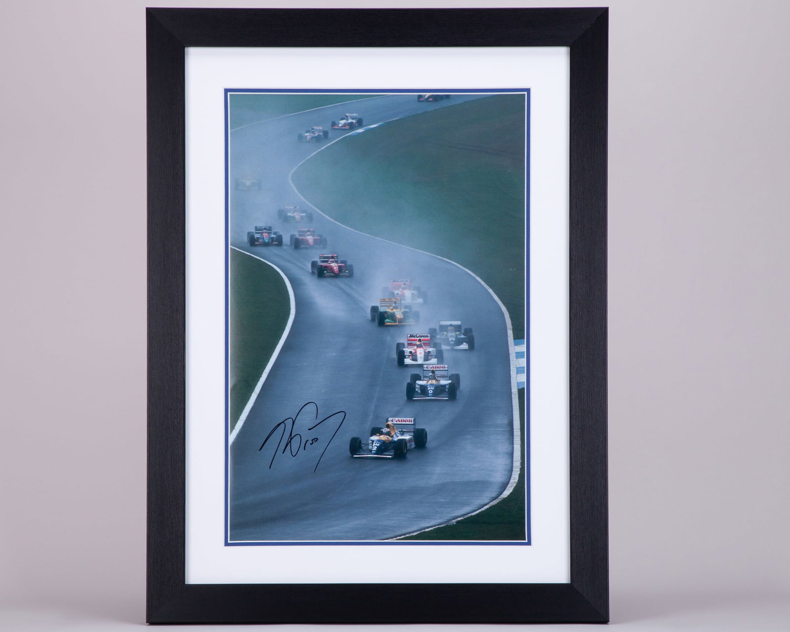 Alain Prost Signed Framed Photo: Alain Prost Signed Framed Photo.This photo has been personally signed by the 4-time F1 World Champion.The frame measures 46cm length x 61cm height. Framed and glazed.Depending on your location it may 