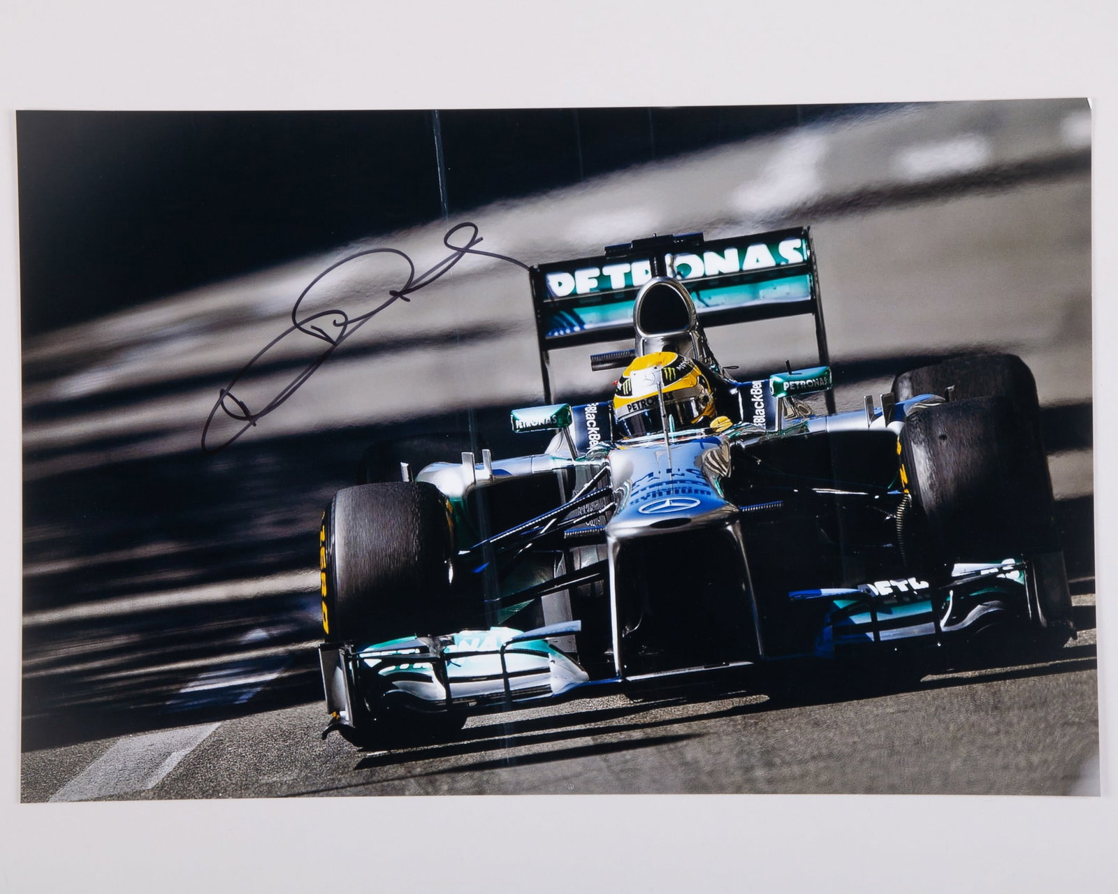 Nico Rosberg Signed Mercedes Large Photo: Nico Rosberg Signed Mercedes Large Photo.The photo measures 46cm length x 30cm width.
