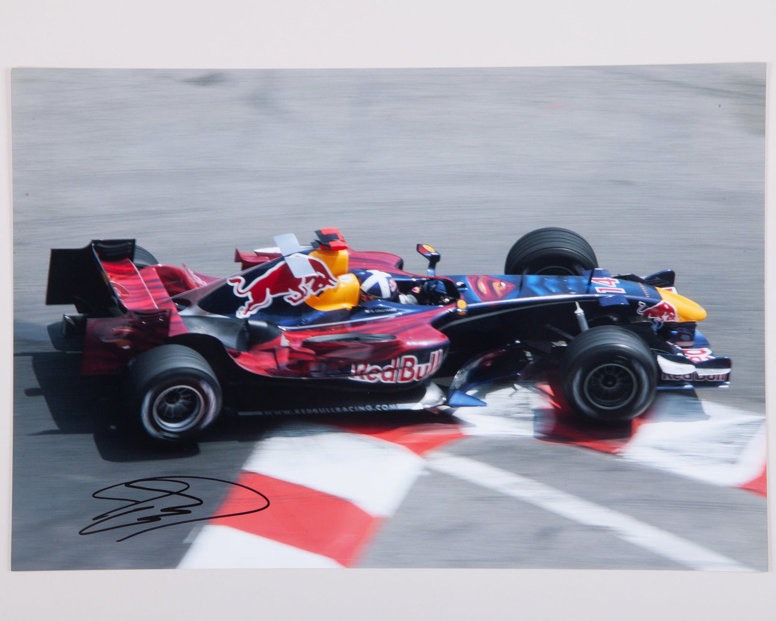 David Coulthard Signed Red Bull Racing Large Photo: David Coulthard Signed Red Bull Racing Large Photo.The photo measures 46cm length x 30cm width.
