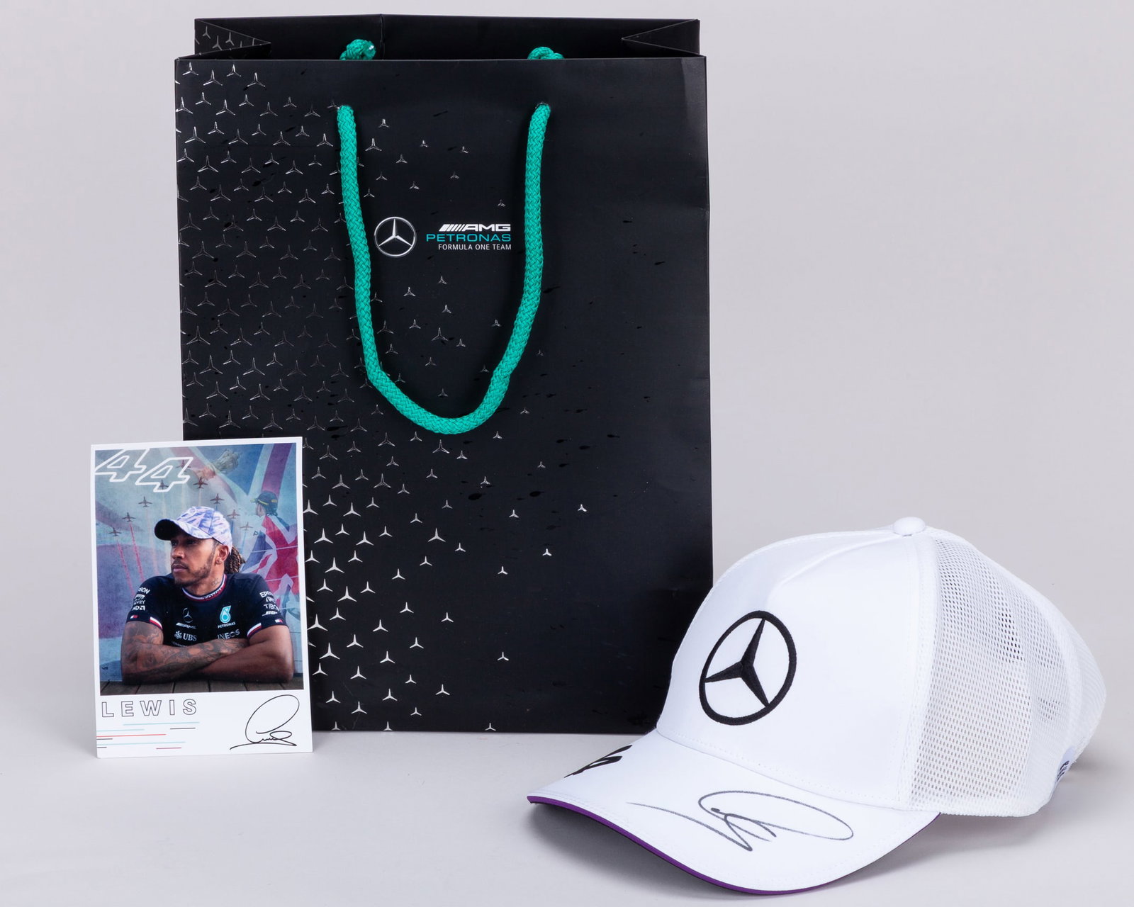 Lewis Hamilton Signed Mercedes-AMG Petronas F1 Team?Cap (New): Lewis Hamilton Signed Mercedes-AMG Petronas F1 Team?Cap (New).This Mercedes-AMG Petronas F1 Team cap is personally signed by the 7-time F1 World Champion.The cap is accompanied with an official Lewis 