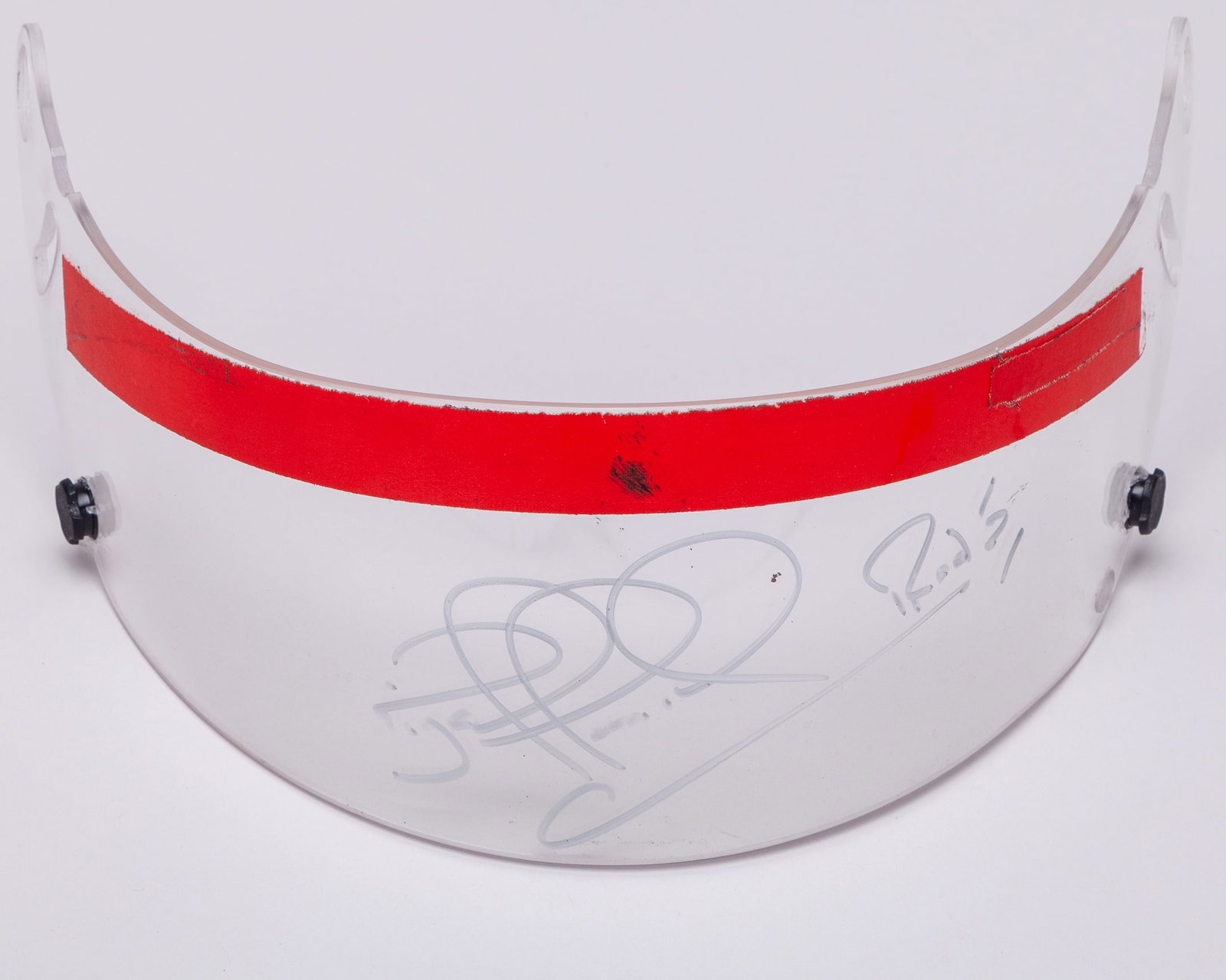 Nigel Mansell Signed Used Visor (Red Strip): Nigel Mansell Signed Used Visor (Red Strip).This used visor was worn by Mansell and is personally hand-signed by the 1992 F1 World Champion.The visor was originally obtained from the Nigel Mansell Col