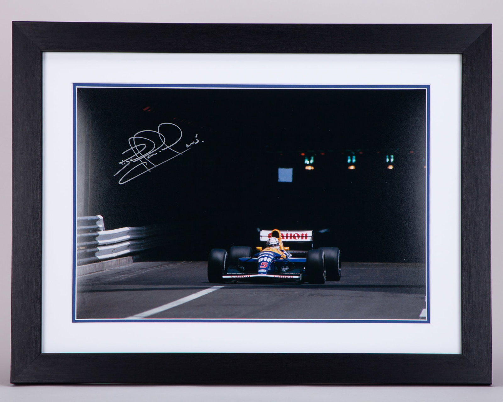 Nigel Mansell Signed Monaco Grand Prix Framed Print: Nigel Mansell Signed Monaco Grand Prix Framed Print.The print is professionally mounted, framed and glazed, and is personally hand signed by Nigel Mansell.The frame measures 61cm height x 46cm width.D