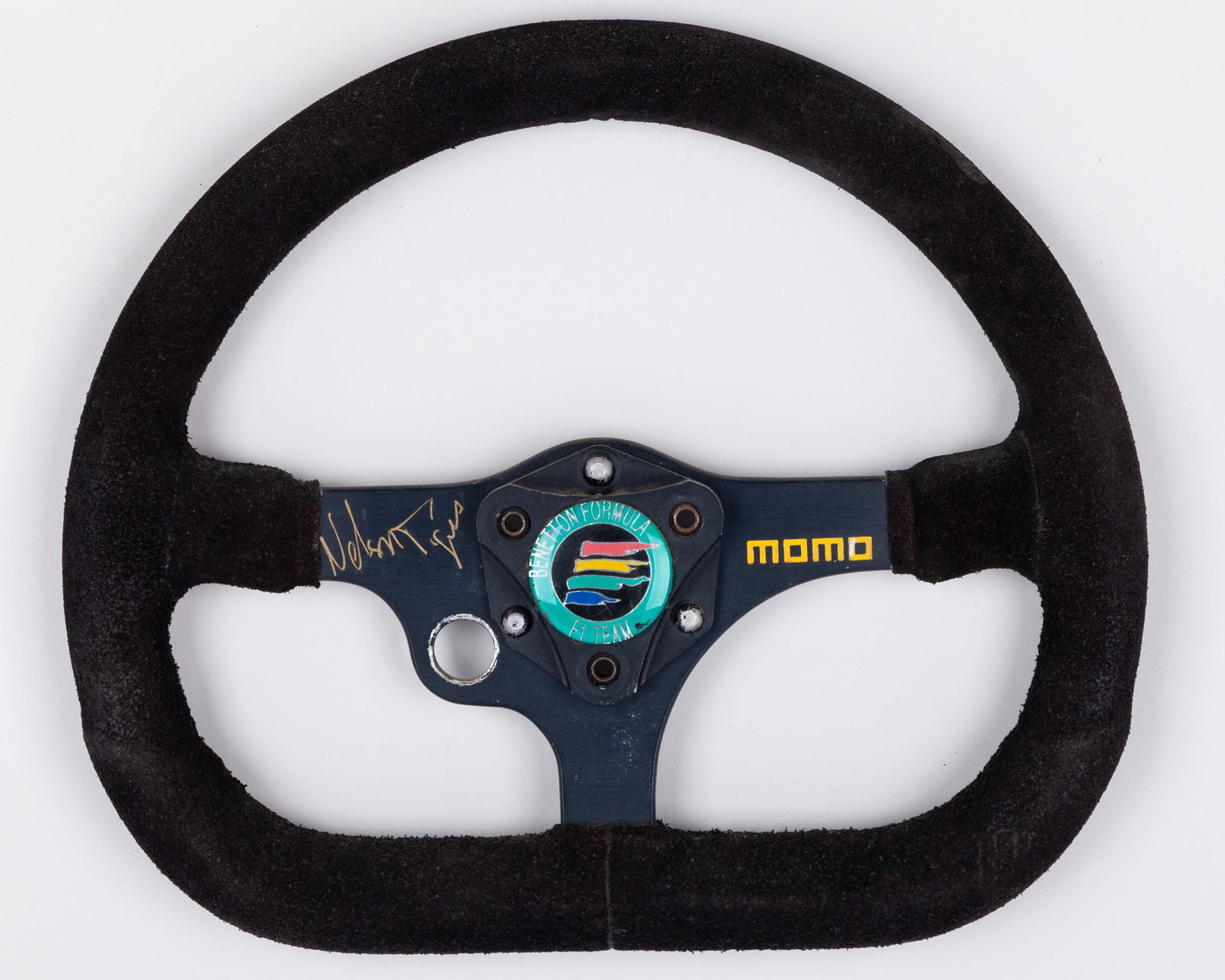 Nelson Piquet Signed Benetton Race Used Steering Wheel: Nelson Piquet Signed Benetton Race Used Steering Wheel.This Benetton race used steering wheel has been personally signed by 3-time F1 World Champion Nelson Piquet.The reverse of the steering wheel is 