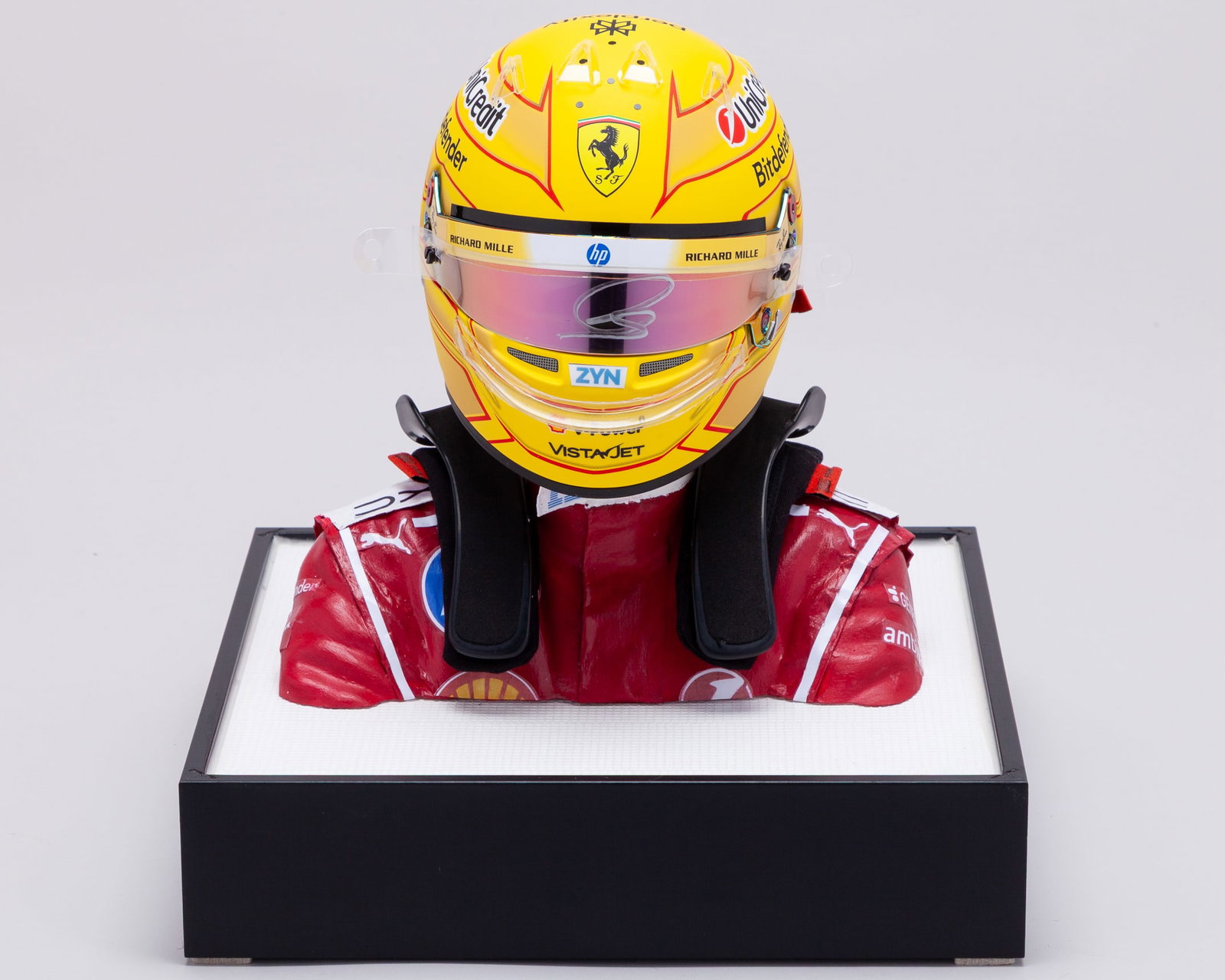 Lewis Hamilton 2026 Ferrari Signed 1:2 Scale Helmet Display: Lewis Hamilton 2026 Ferrari Signed 1:2 Scale Helmet Display.The helmet is personally signed by the 7-time F1 World Champion.Complete with HANS device, mannequin and display case.