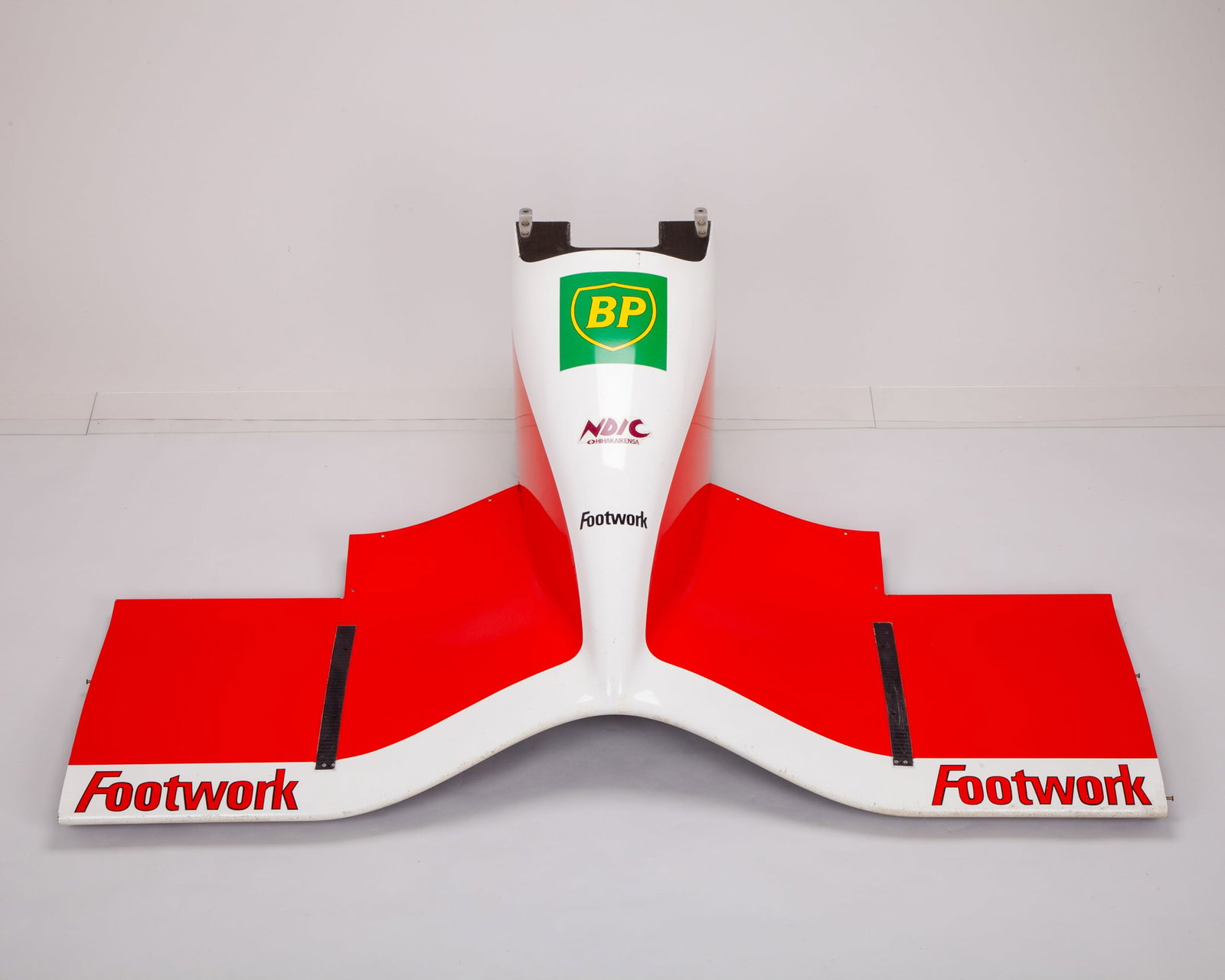 Footwork Arrows 1992 FA13 Race Used Complete Nose Cone: Footwork Arrows 1992 FA13 Race Used Complete Nose Cone.This is an original race-used complete nose cone from the Footwork Arrows FA13 Formula One car, representing an authentic piece of Grand Prix rac